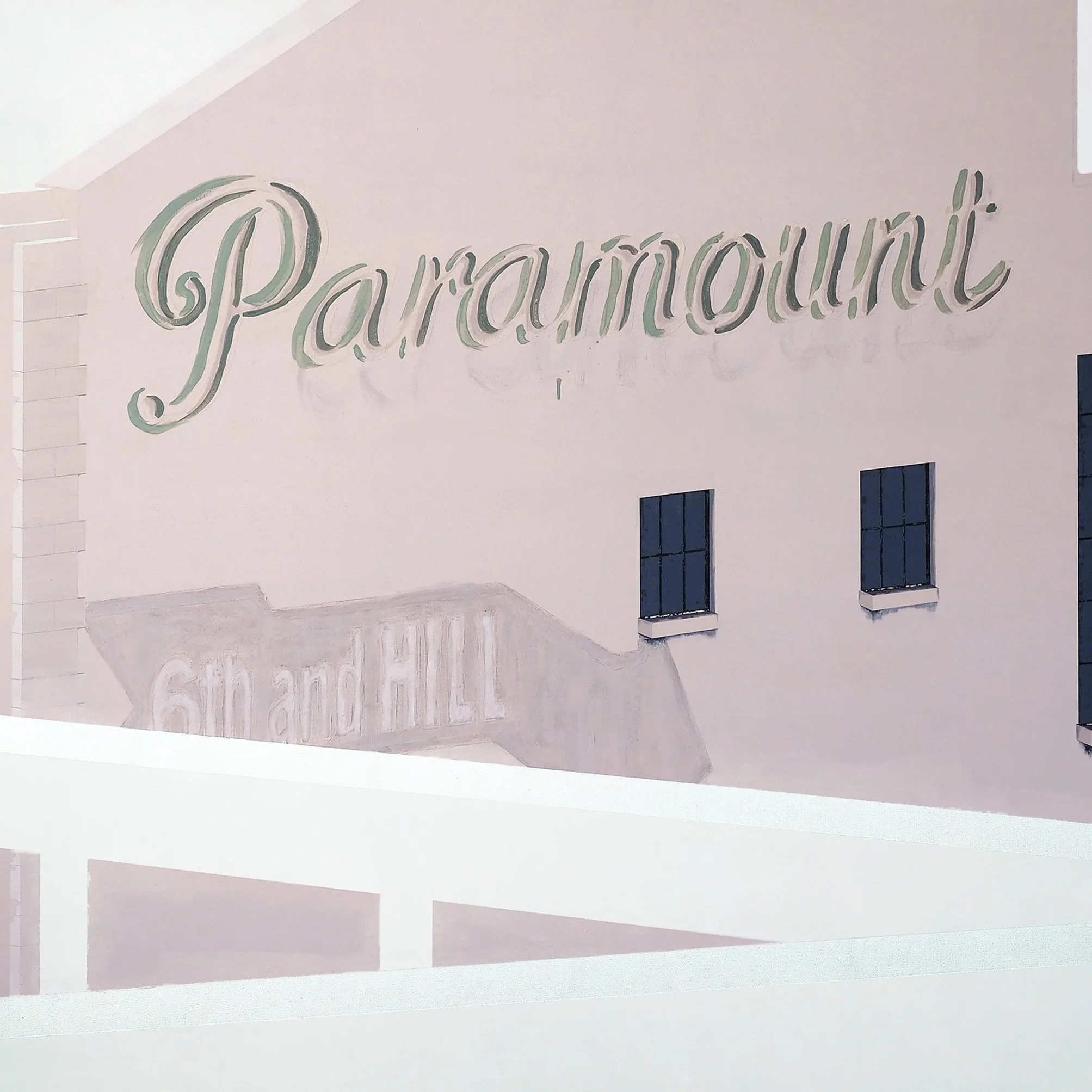 Sign with cursive text reading 'Parauirpui' on a white wall.