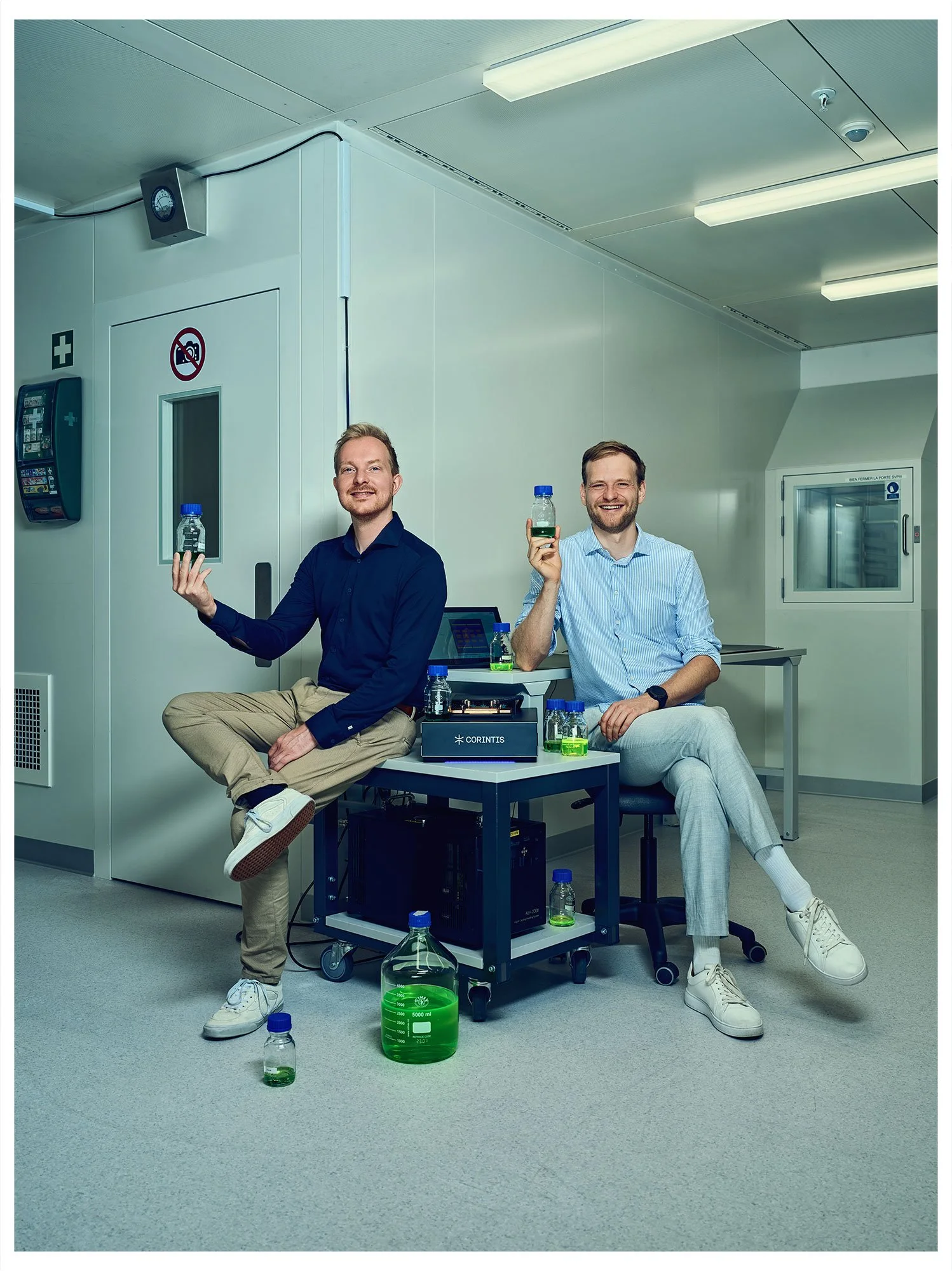 Corintis founders Remco van Erp and Sam Harrison with liquid-cooling technology, photographed for the TOP 100 Swiss Startup Magazine 2026.