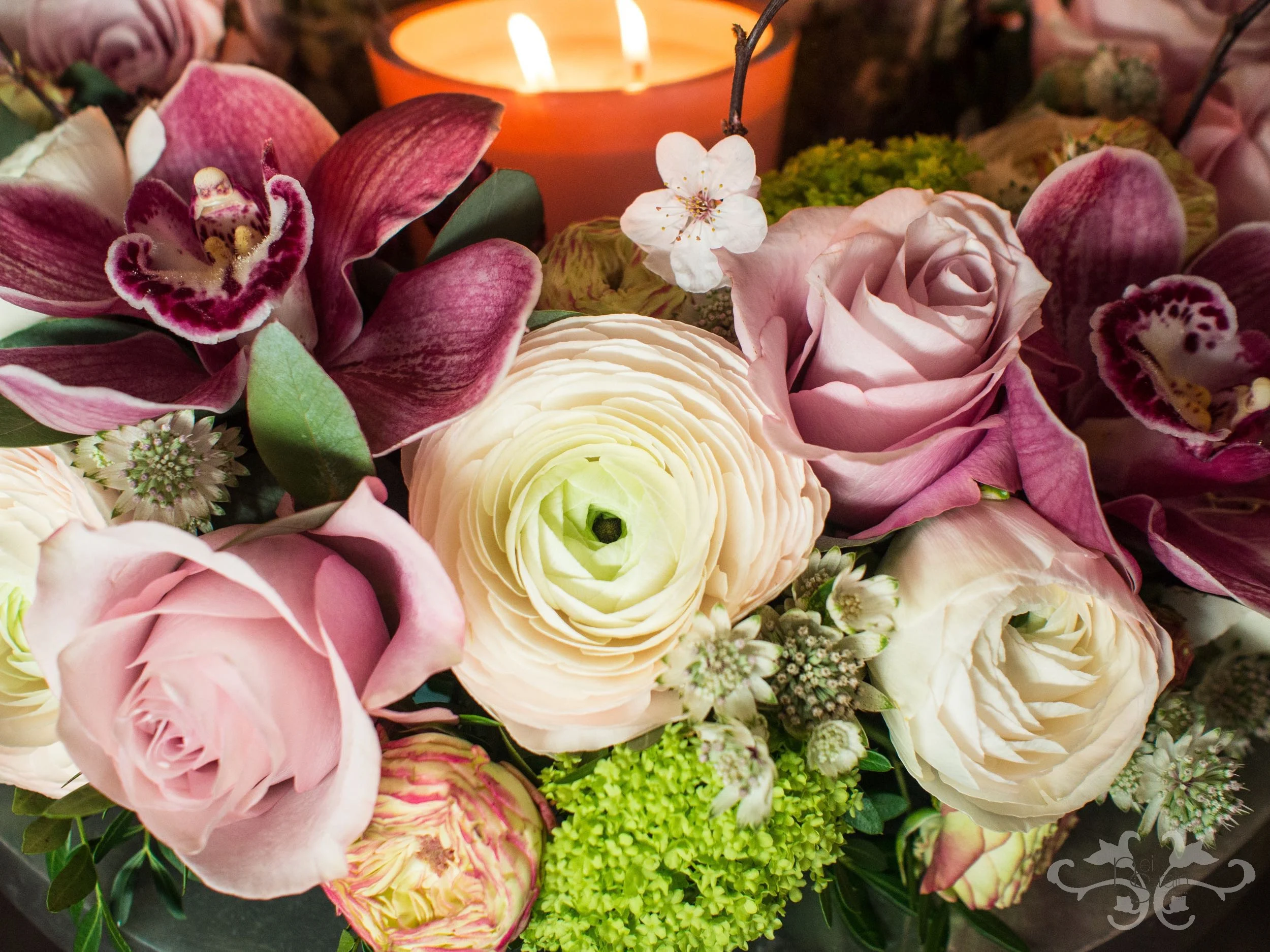 Roses, Renunculus, Cymbidium Orchids, Viburnum Opulus, Astrantia, Blossom. Photography by John Nassari