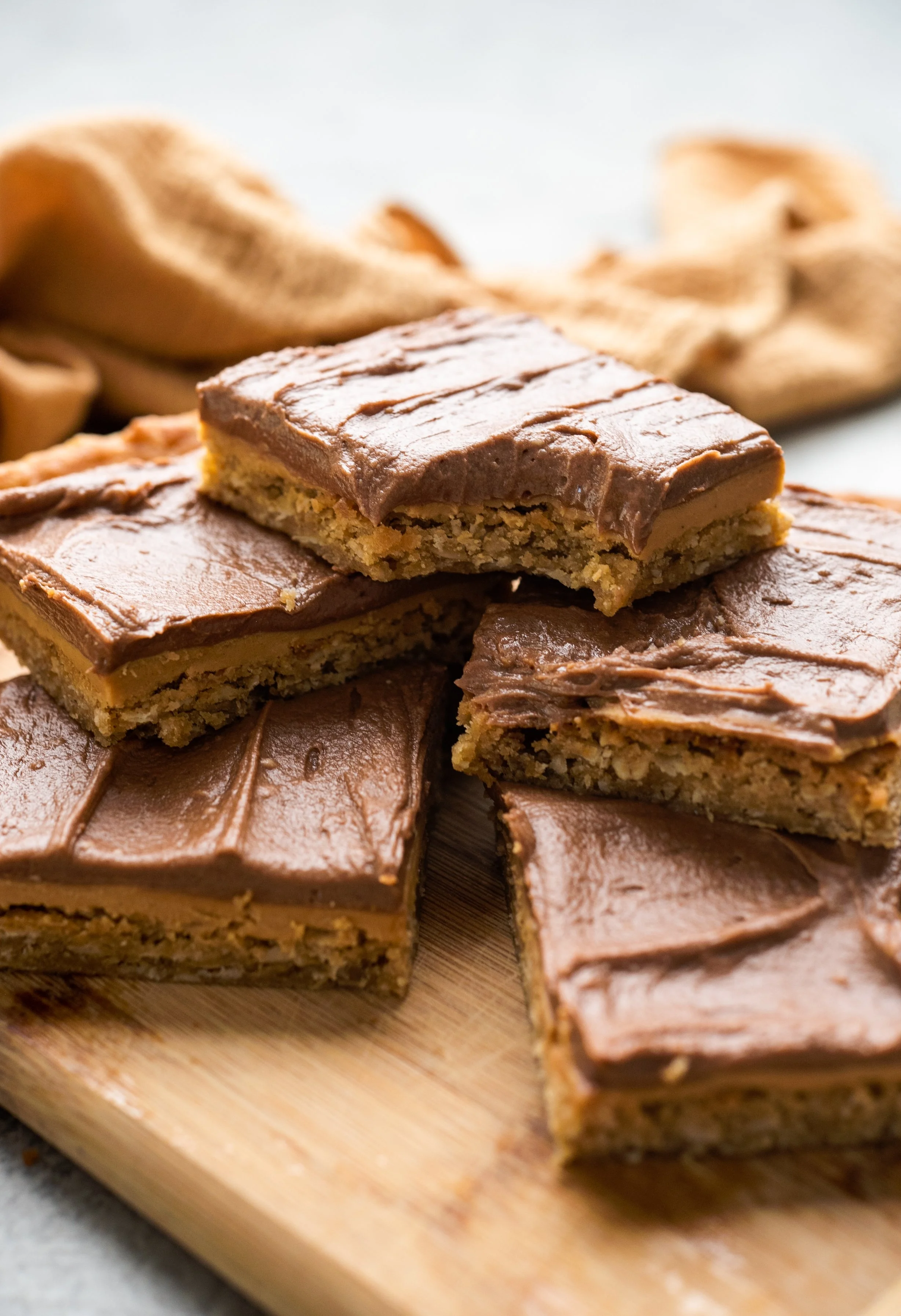 image of chocolate peanut butter bars and a glass of milk