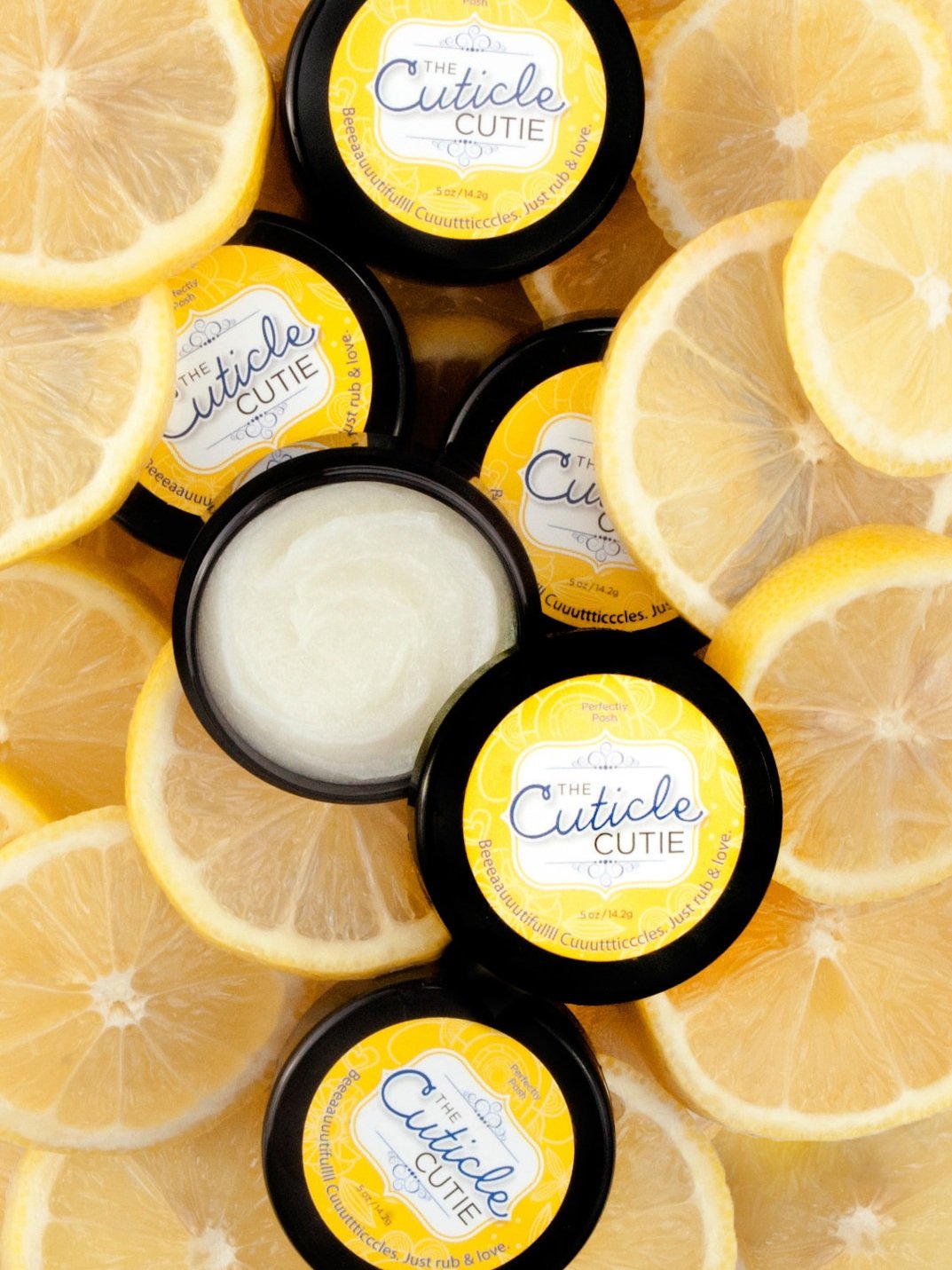 Styled beauty product photographed on fresh lemon slices