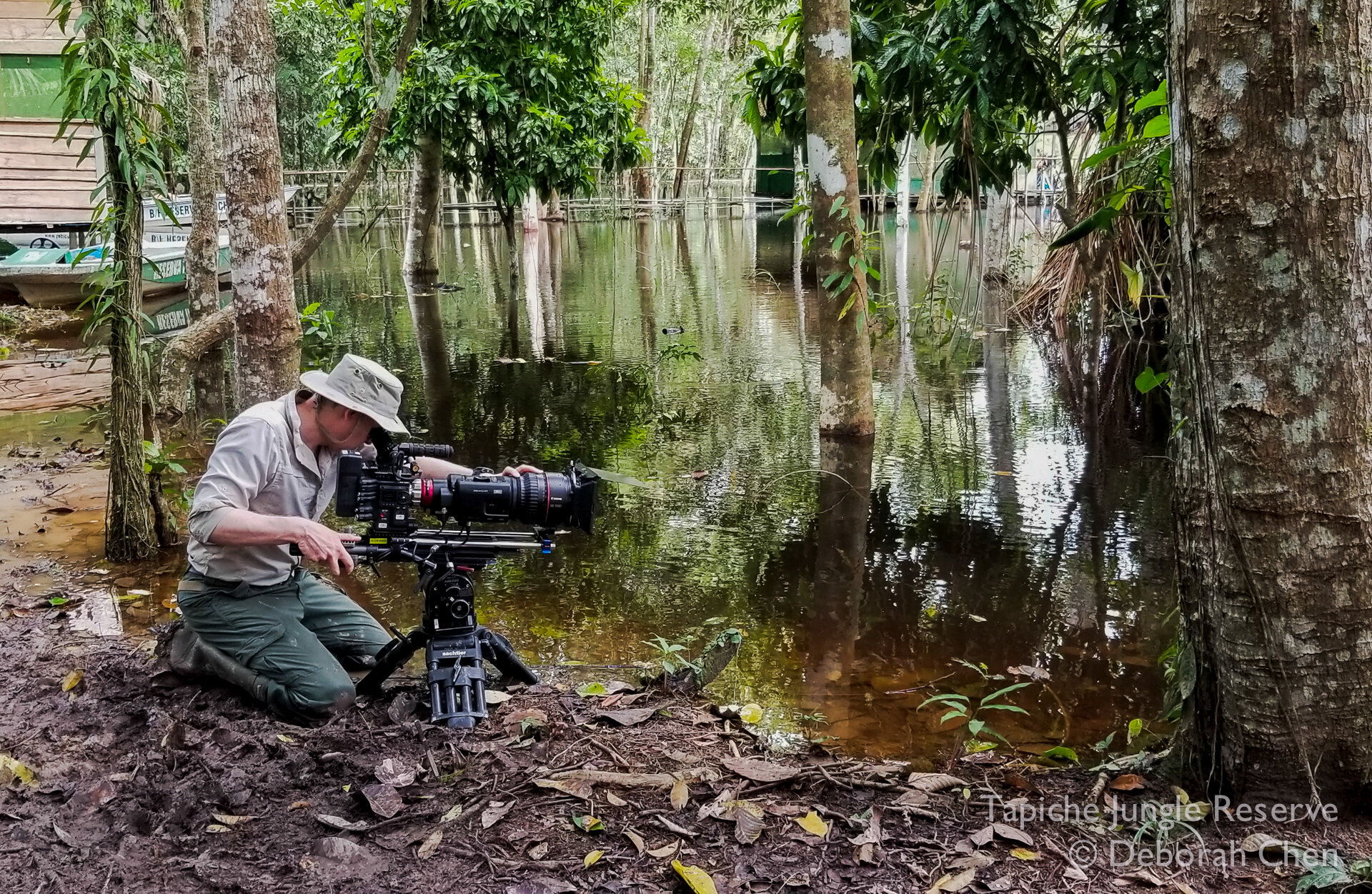  Cameraman John Brown is down to his knees in the mud while filming the fire ants rafting to open waters 