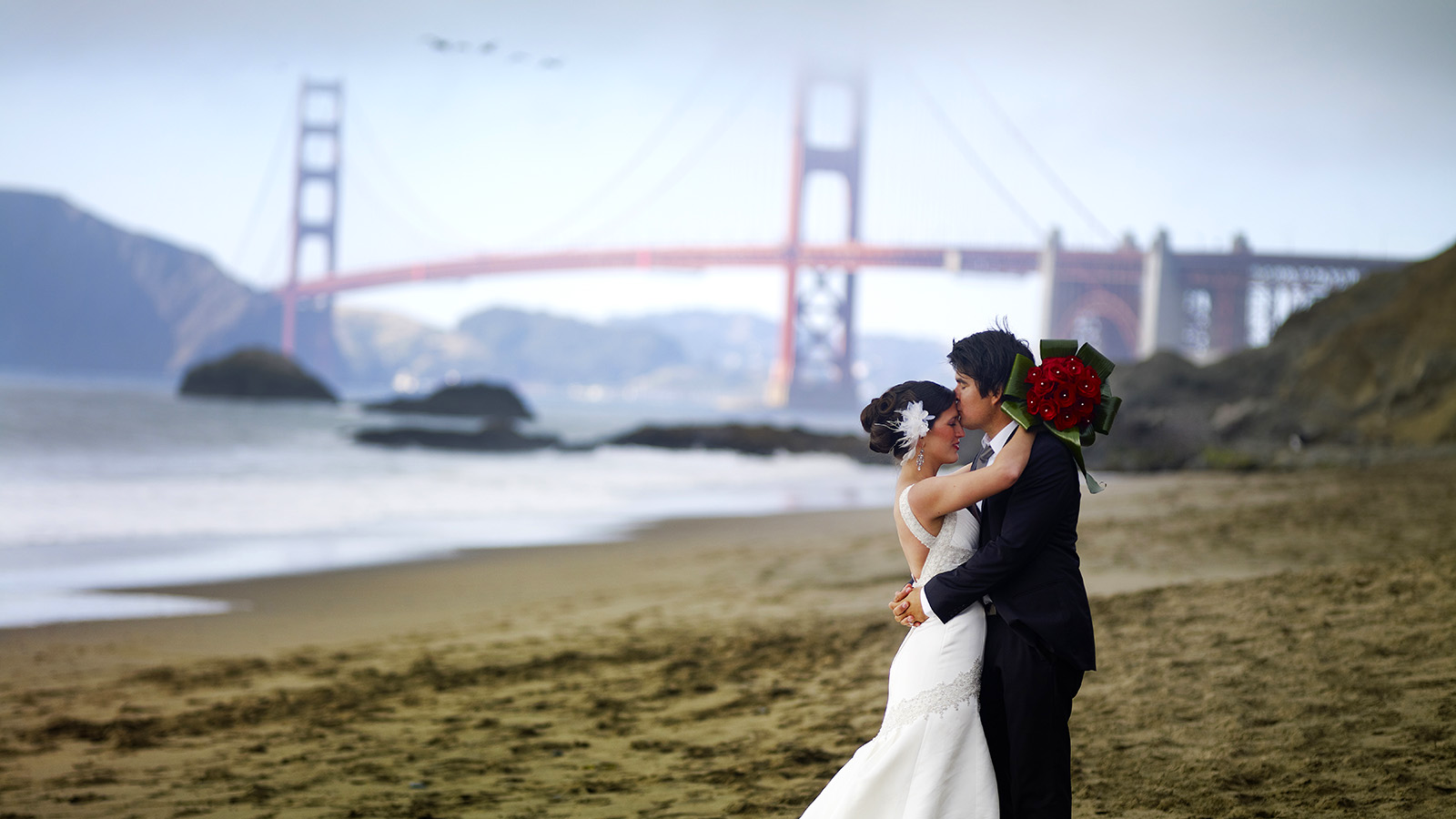Romantic bride and groom photo at Baker Beach