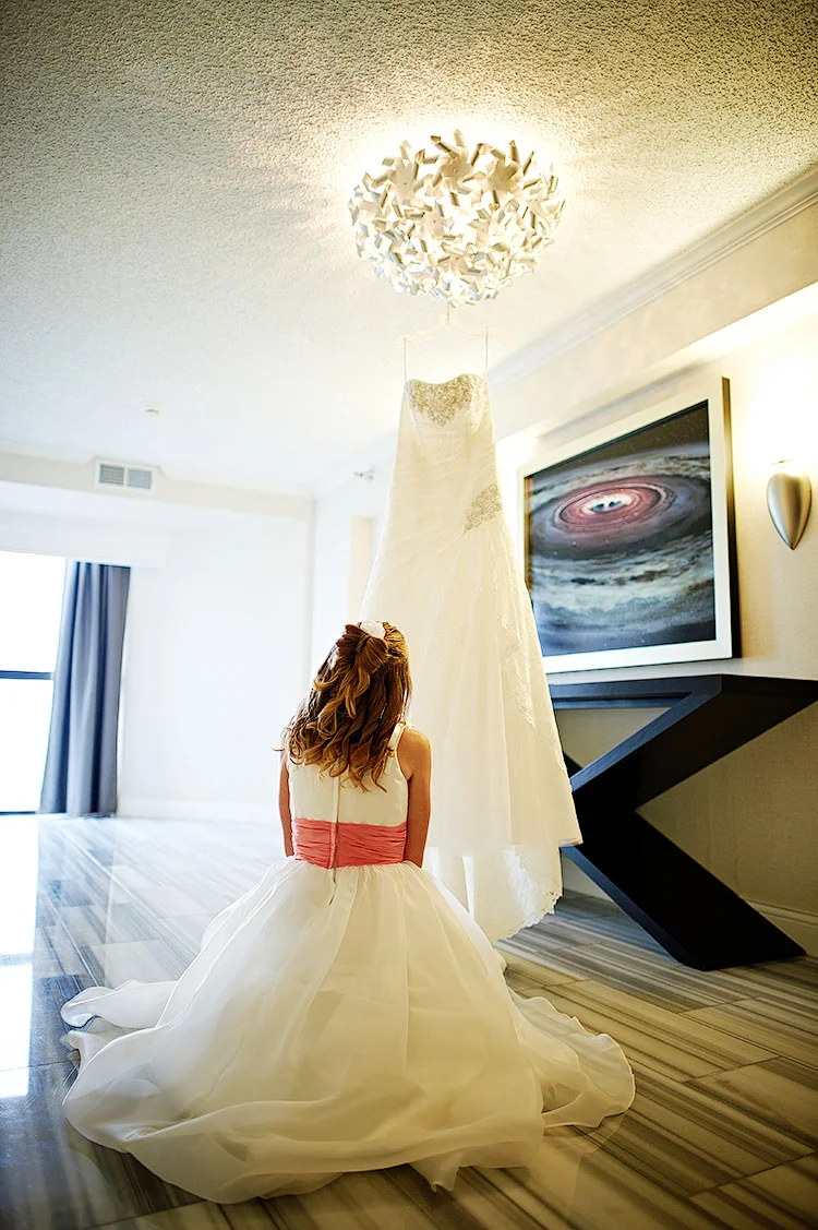 Alee contemplating her mother's dress.