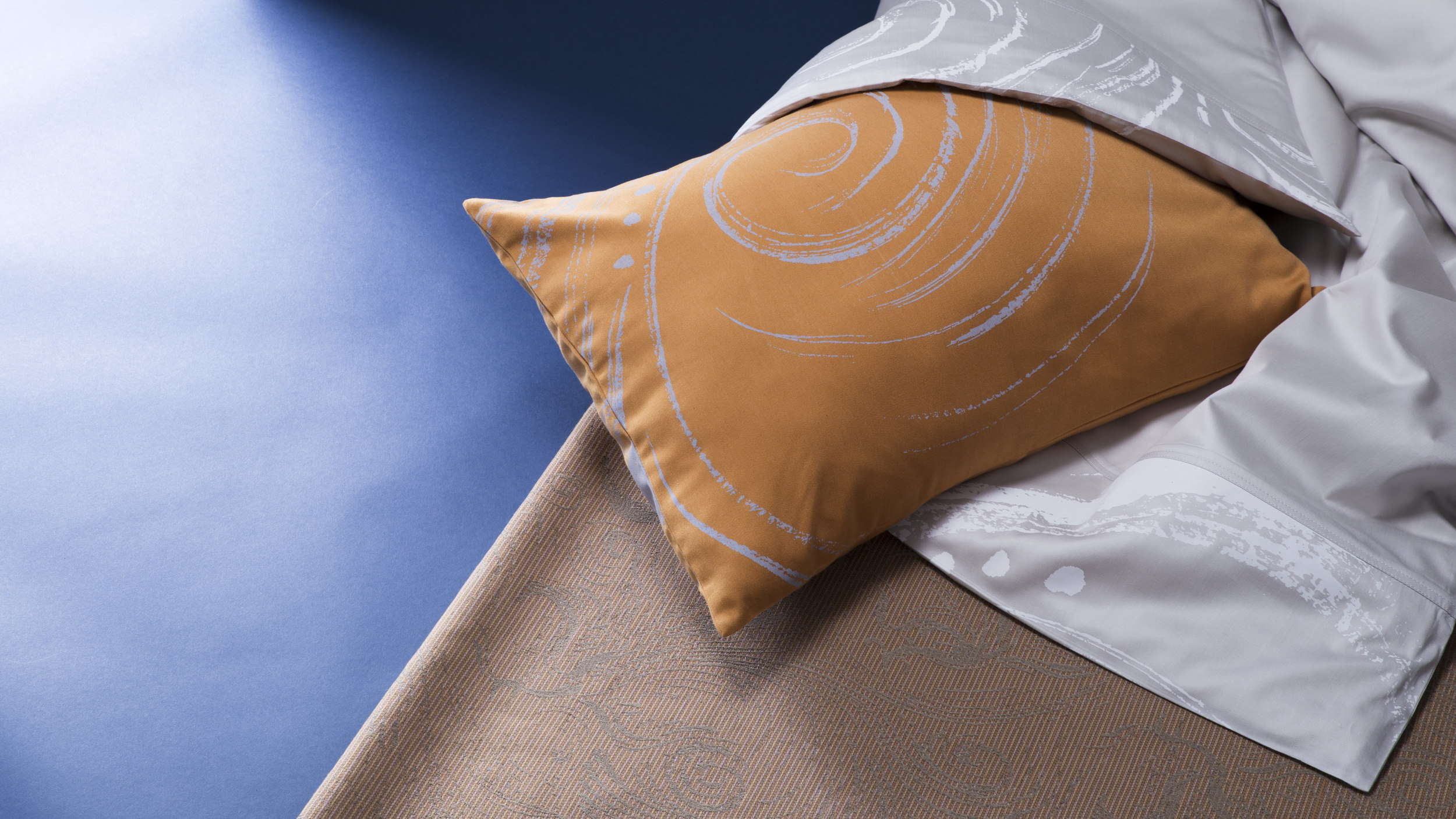 Textiles on floor with 4ft wide Colorama paper 'Oxfod Blue'