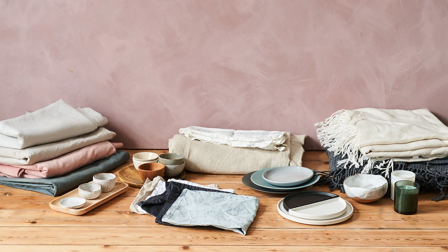 New props for the studio including linens, blankets, candles and ceramics.