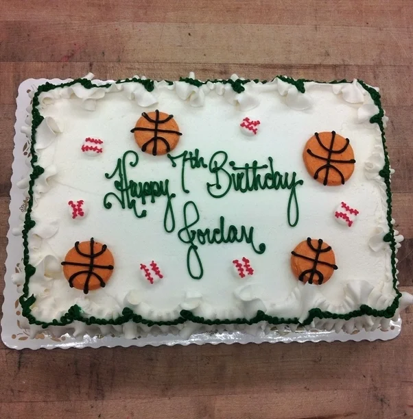 Sheet Cake with Piped Basketballs and Baseballs