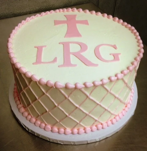 Round Cake with Pink Fondant Cross and Monogram