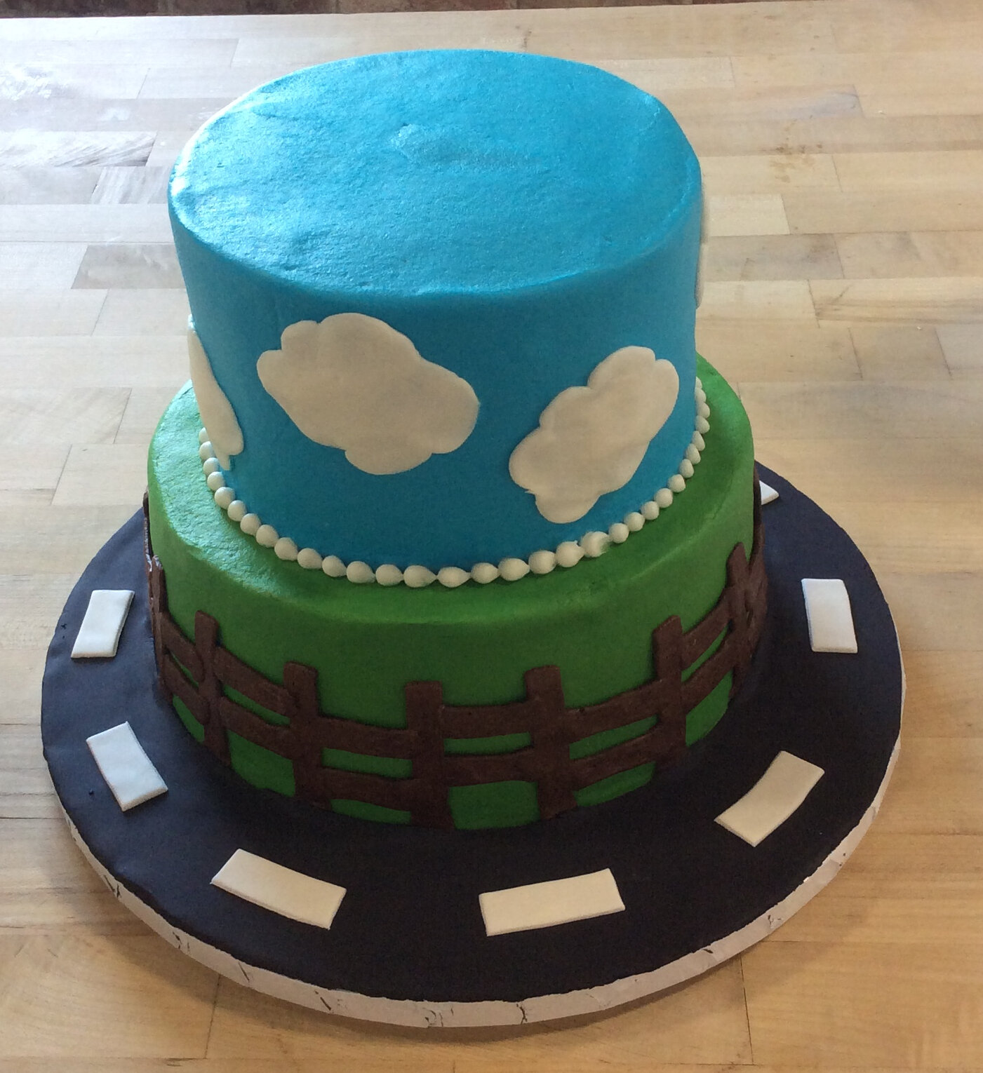 sky clouds fence party cake.jpeg