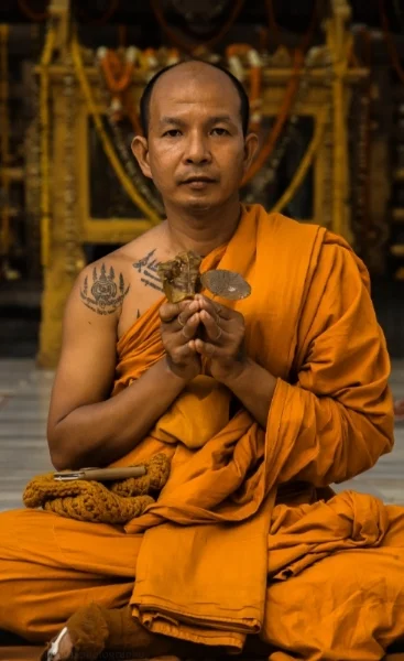  Visiting Thai monk holding Bodhi Leaves at Maha Bodhi Temple