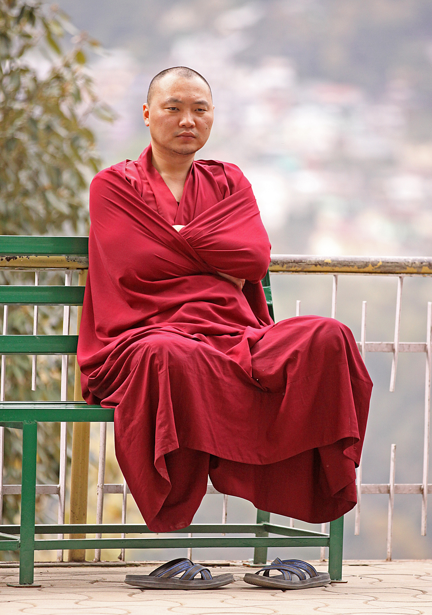Website Dharmsala Buddhist sitting arms crossed.jpg