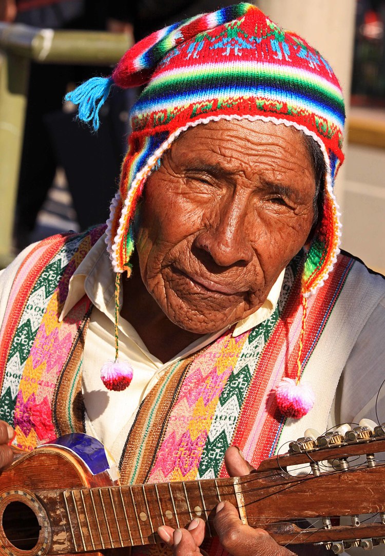 Peru W man and guitar Lake Titicaca Puno Peru.jpg