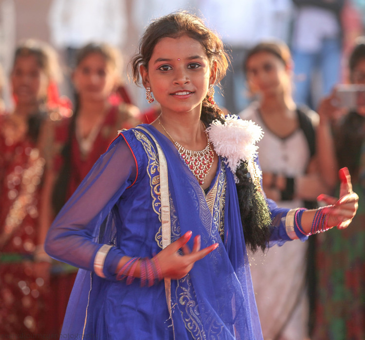 website girl in blue dancing facing varanasi.jpg