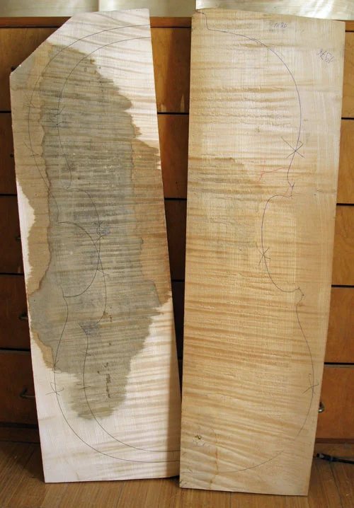 A cello back cut in 1976. The light patches are where I've been flattening the back -- in the end, there will be just enough left to carve a full arch.