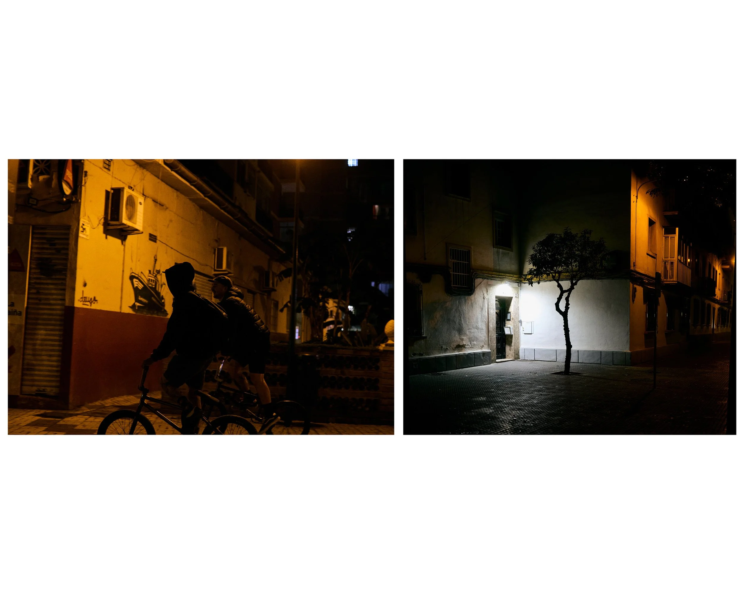 Two nighttime images of urban streets, one showing two silhouetted people riding bikes past a mural on a building, the other showing a lit doorway with a small tree nearby
