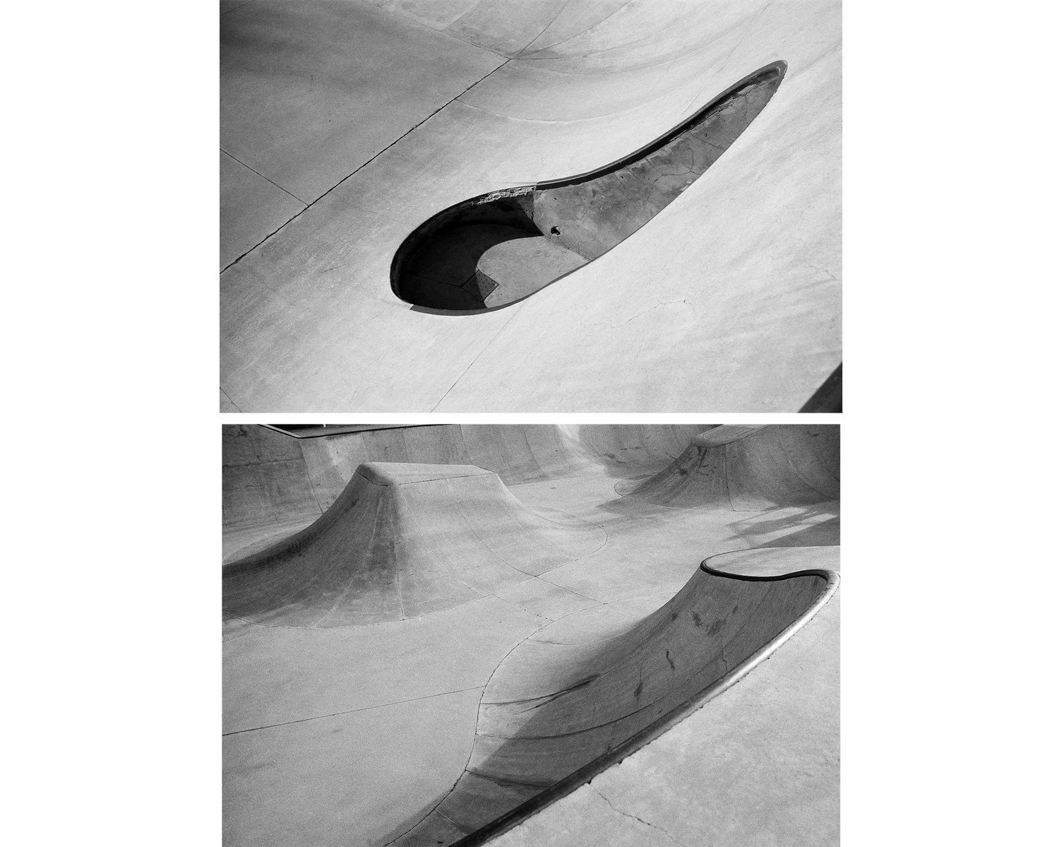 Black and white photo of a skatepark with smooth, curved concrete ramps and bowls, designed for skateboarding.
