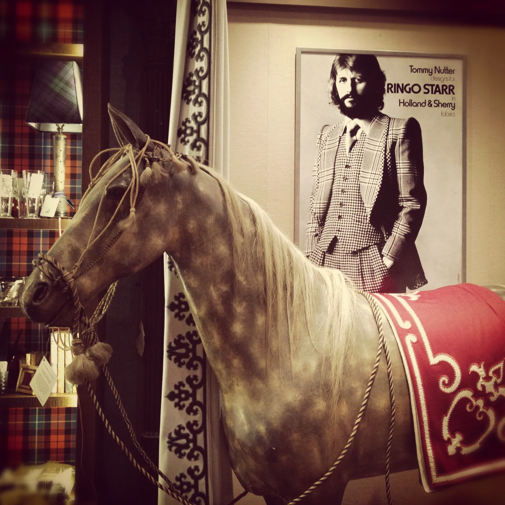 How awesome does Ringo Starr look in this old Holland & Sherry ad?