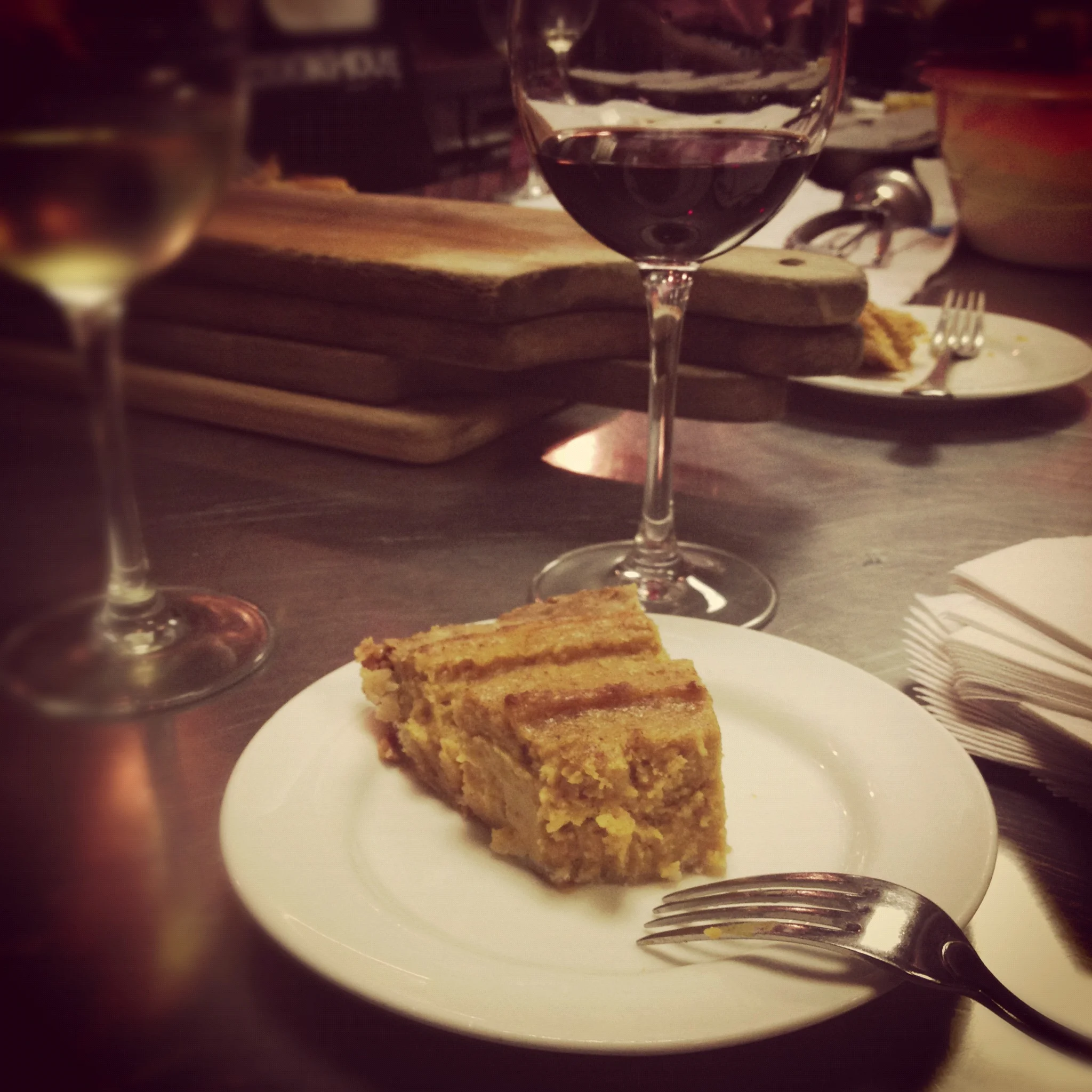 A slice of sweet potato pie and a glass of red wine #singlegirldinner