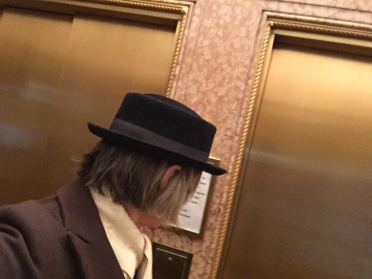 Me in the lobby of the Library Hotel waiting for the elevator.