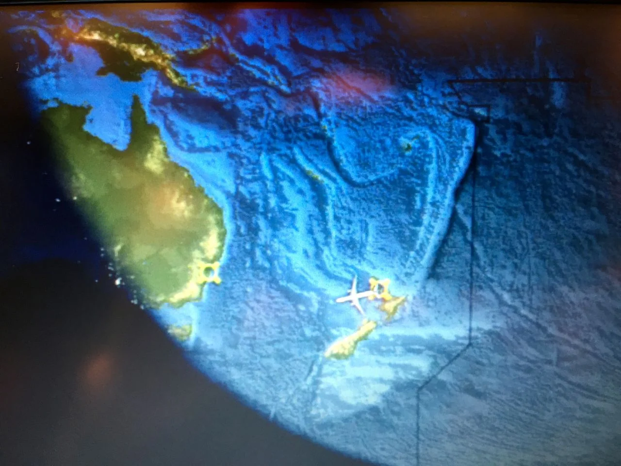 See our tiny 9AM plane just below the 'midddle' of this photograph leaving New Zealand and heading, actually, the wrong way. California is to the RIGHT. 