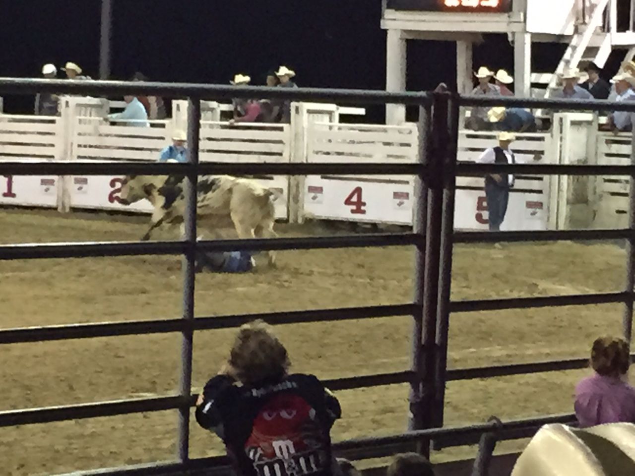 The rider has been thrown off and is momentarily under the bull. 