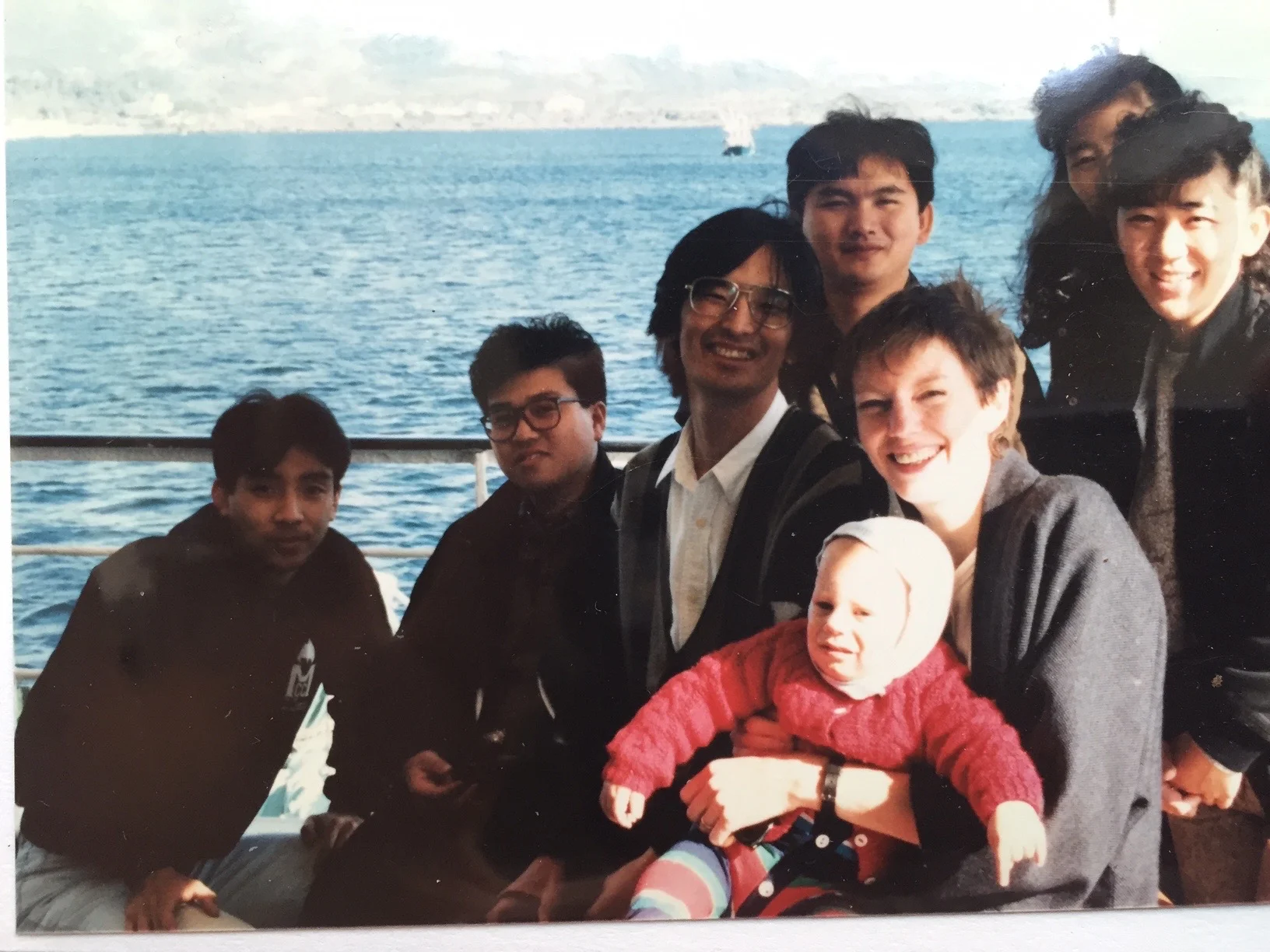 With students of Kagoshima University on a boat in front of Sakurajima, one of the most active volcanoes in the world. The towns on either side of the volcano share ash-removal equipment depending on where the prevailing wind is depositing the ash.