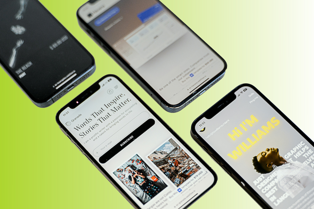 Four smartphones on a bright green surface, displaying various websites and social media apps.