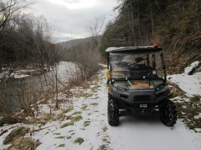 side by side on snowy trail.JPG