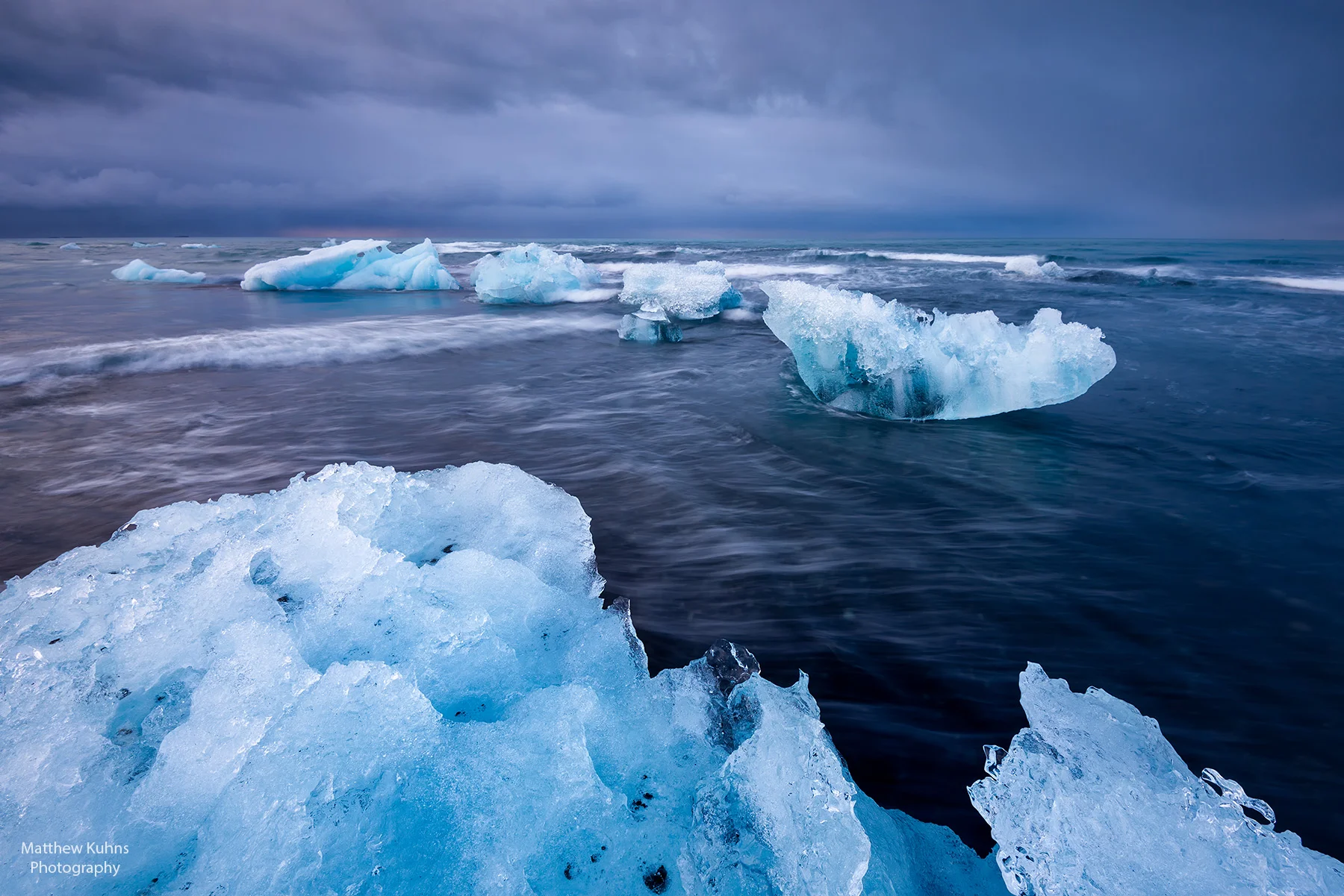 Click to Enlarge. Icebergs in the surf at Jokulsarlon.