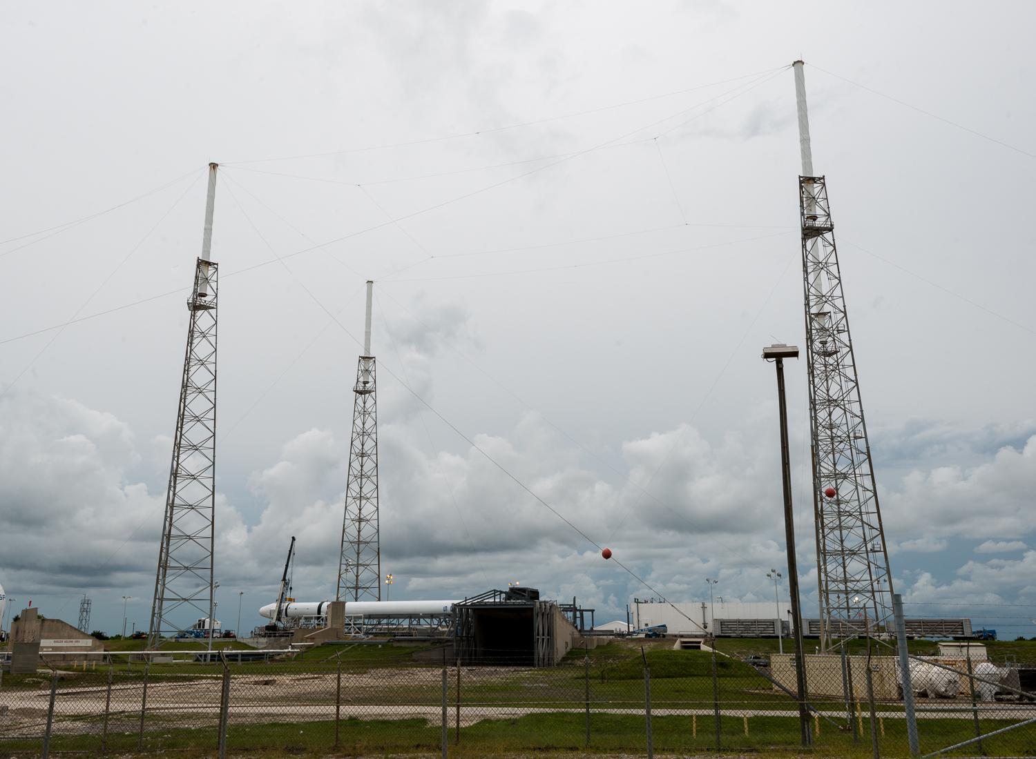 A view of the Space X pad with the Falcon 9 on its side. 