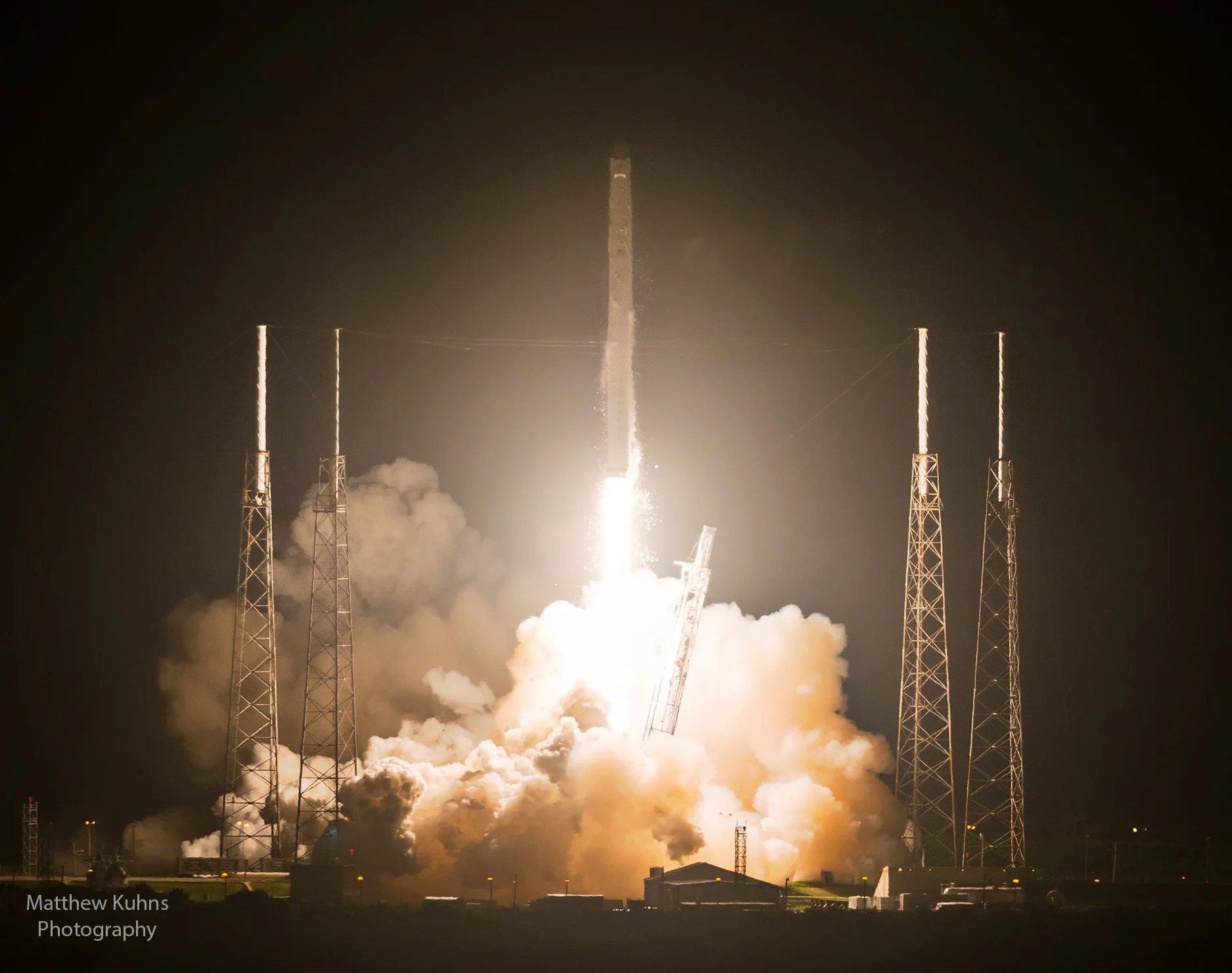 The Falcon 9 rocket with the Dragon and payload bound for the international space station clears the tower.