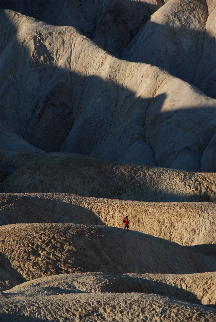 Matthew walking through Golden Canyon in Death Valley during a sunrise shoot. Image by Palmore Clarke