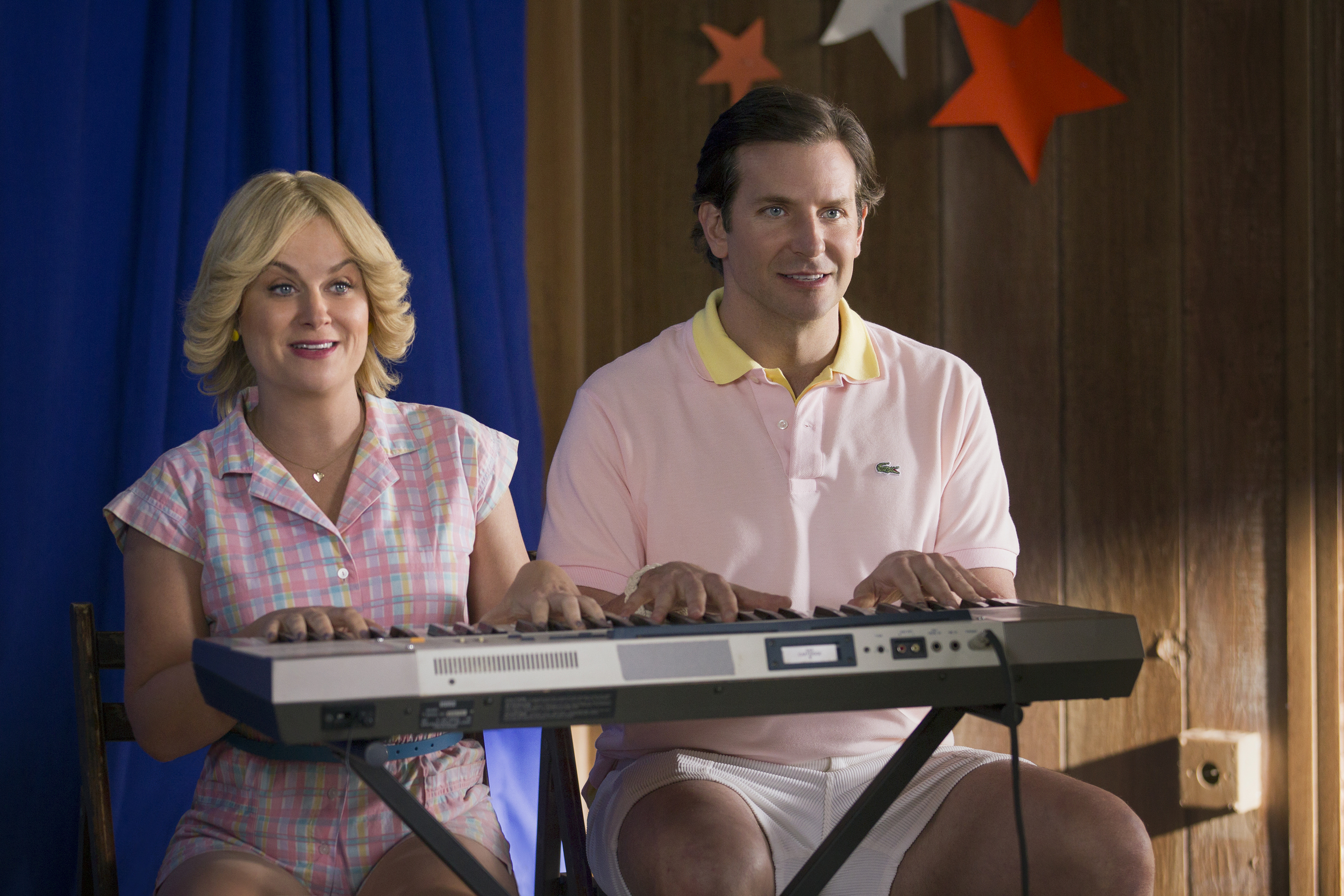    Amy Poehler and Bradley Cooper in the Netflix original series “Wet Hot American Summer: First Day Of Camp”.  Photo by: Saeed Adyani/Netflix  