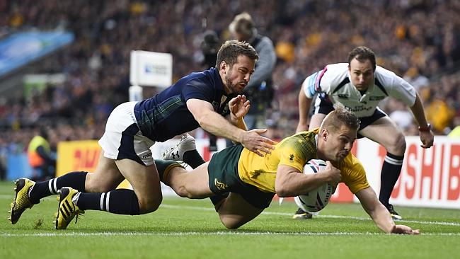   Drew Mitchell in the process of scoring against Scotland in the World Cup Semi-Final at Twickenham.  image copyright - Reuters 