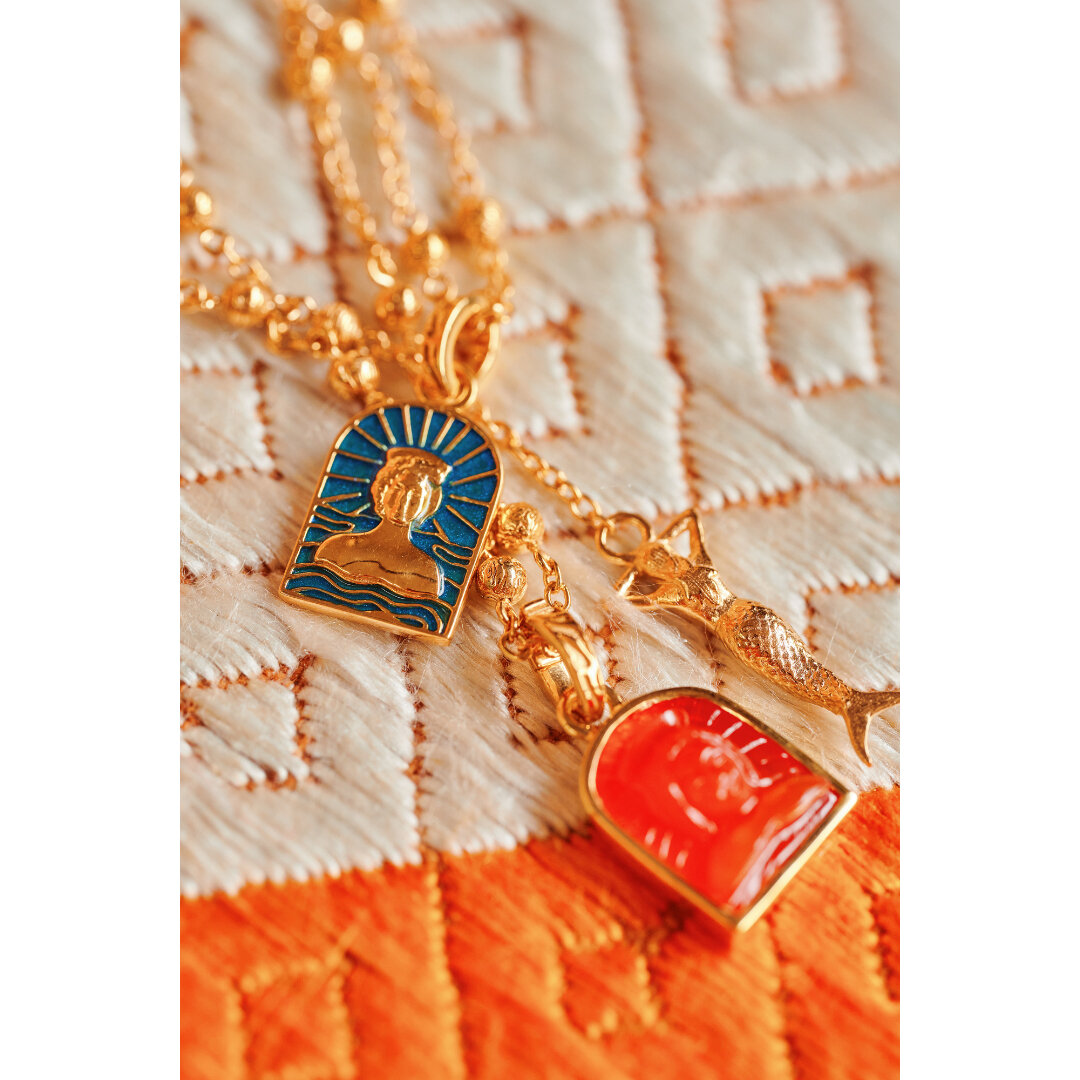 Annie&rsquo;s Ibiza x Jade Jagger​​​​​​​​
​​​​​​​​
Goddess of Ibiza, Tanit - in blue enamel and hand-carved in orange carnelian. All pieces from the collection are available at anniesibiza.com and in both her stores.​​​​​​​​
​​​​​​​​
For enquires ple