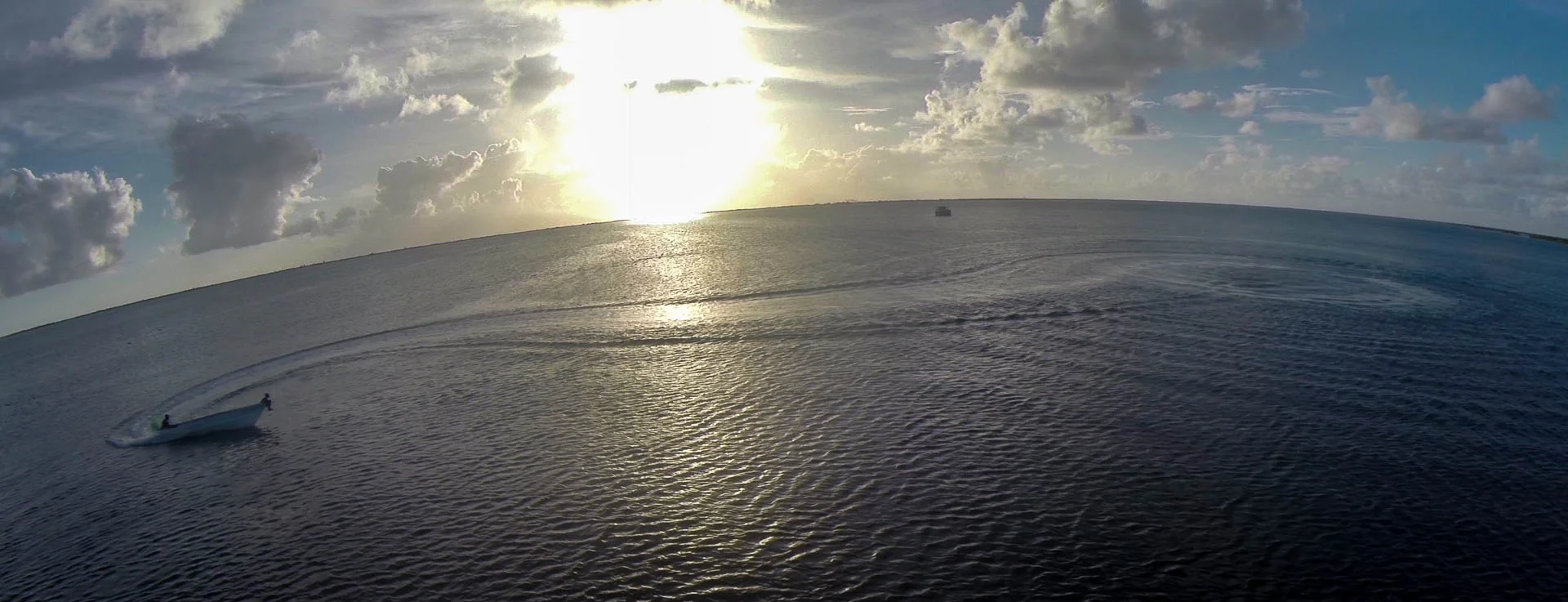 Kids doing donuts in Codrington Lagoon, Barbuda Island - video still, Tom Miller