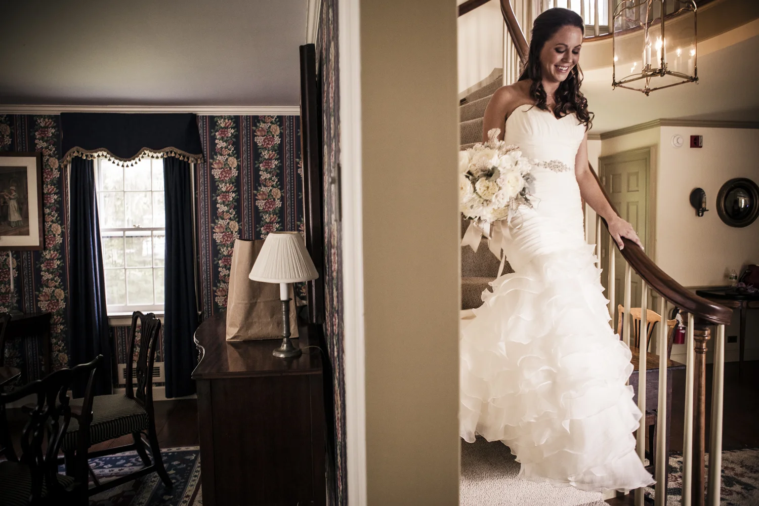 Rachel & MIchael - Grafton, VT - Katie grabbed this as Rachel was coming down to stairs to head over to the chapel. I love the split showing both rooms. Rachel's excitement and beauty on one side and the quiet historic american decor on the other side. Rachel and her entire family were just wonderful to us. This wedding to me was calm, sweet, quiet, romantic until the reception, then it was just nuts! Which is how it should be in my opinion. 