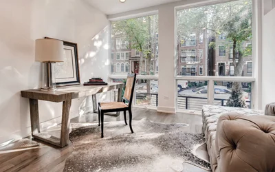 desk in home office with large window