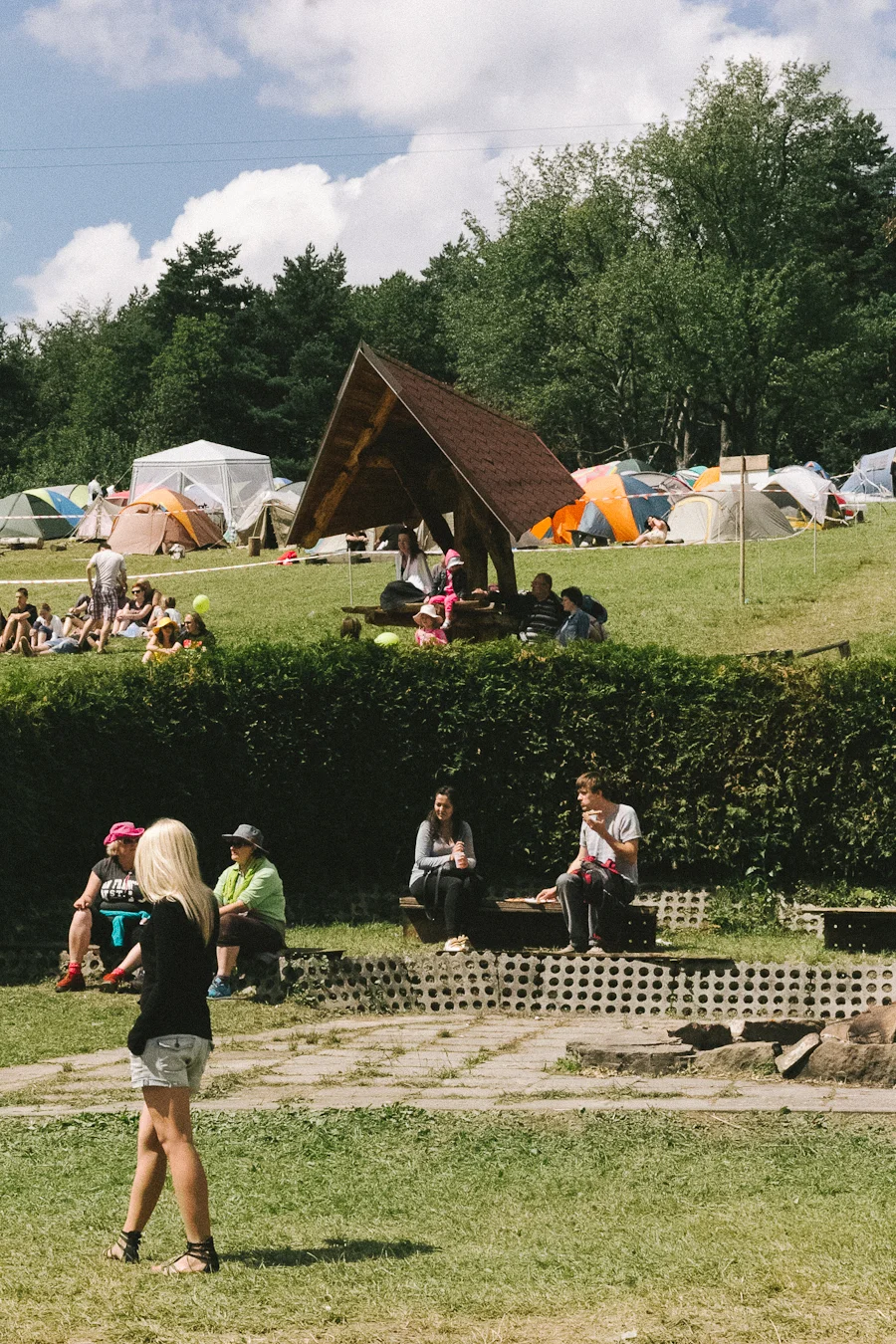 People camping on the hillsides.