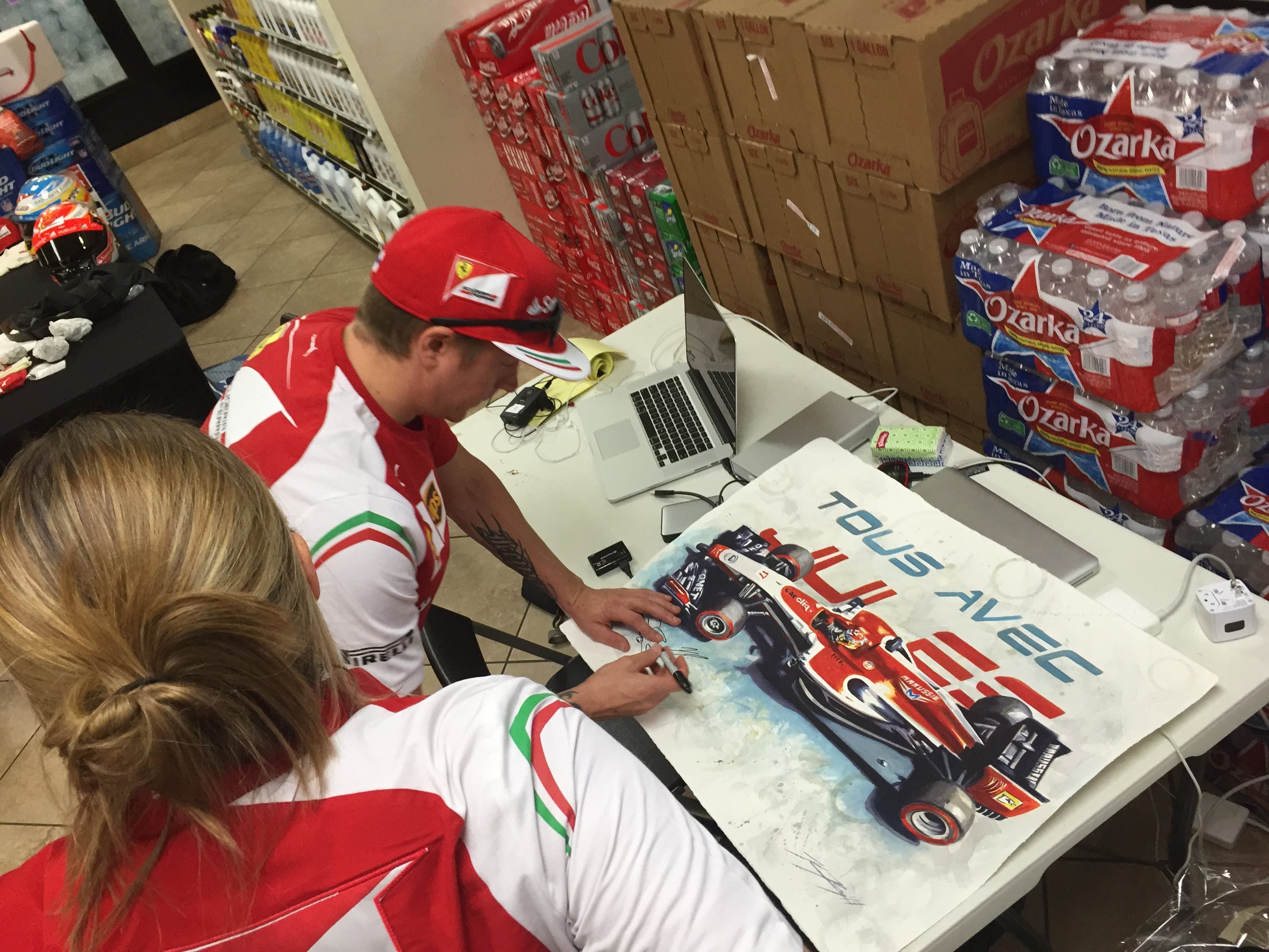  Kimi signing a tribute painting 'With You' of Jules Bianchi at the USGP 