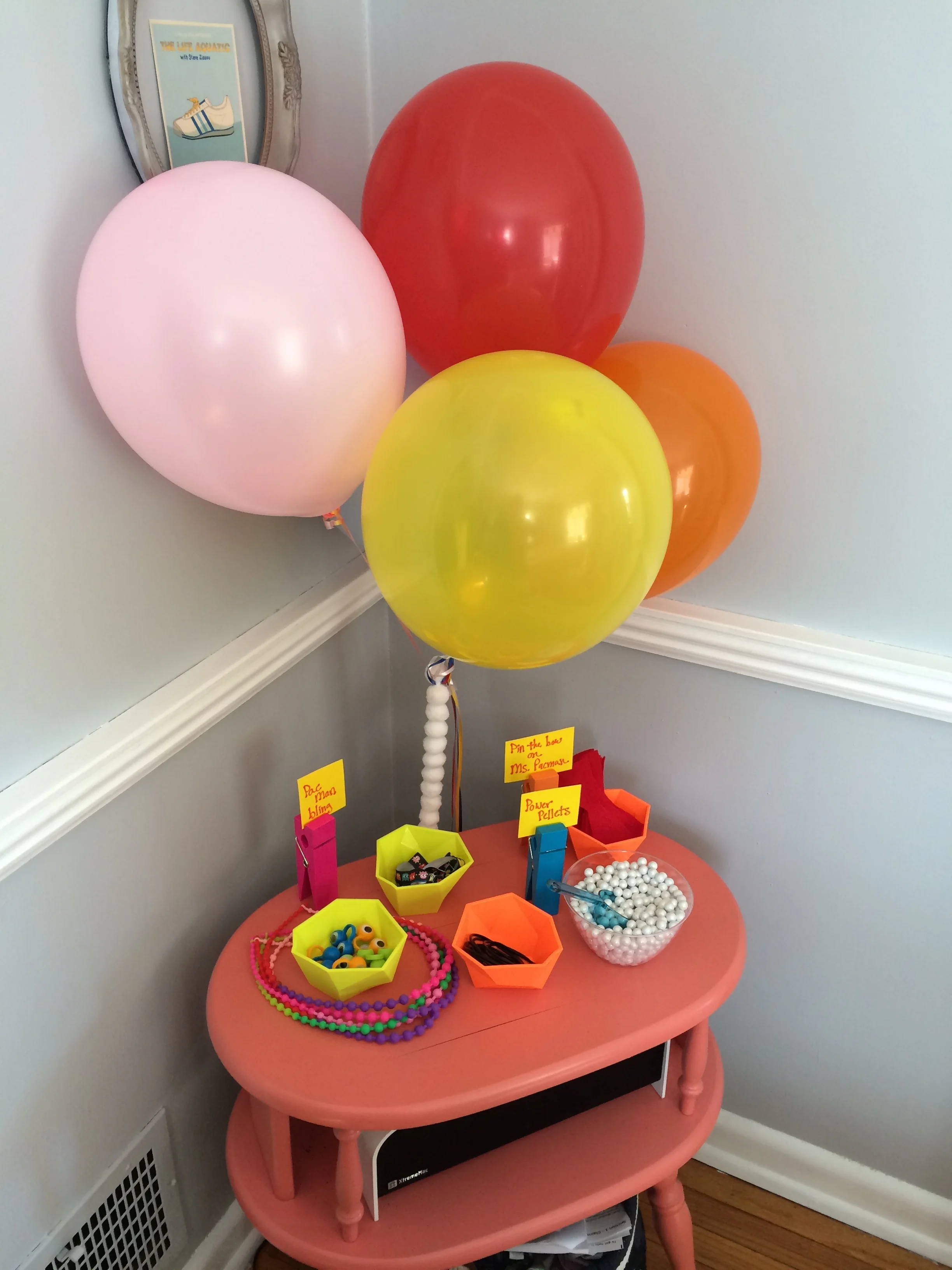 Party favors of rubber jewelry and power pellets (pearly white Sixlets).