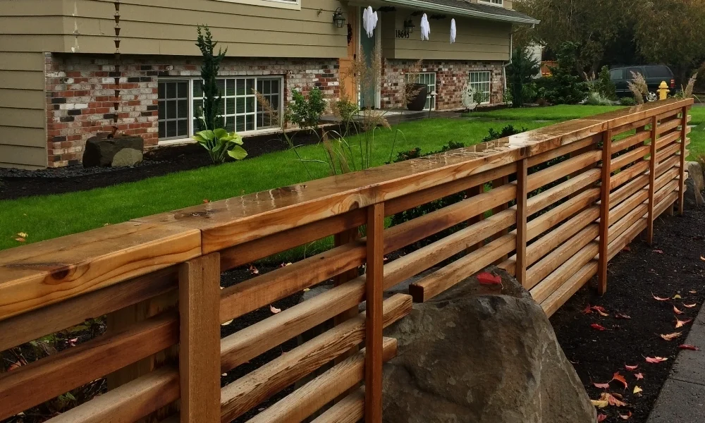  Modern screen with horizontal slats defines this corner of the yard. 