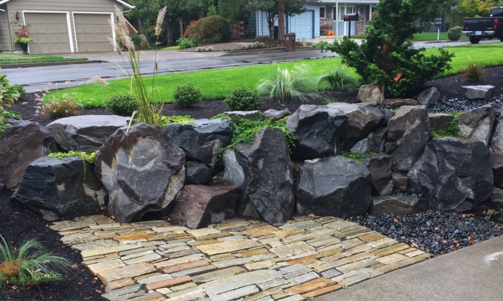  A boulder retaining wall doubles as a climbing wall for the kids. 