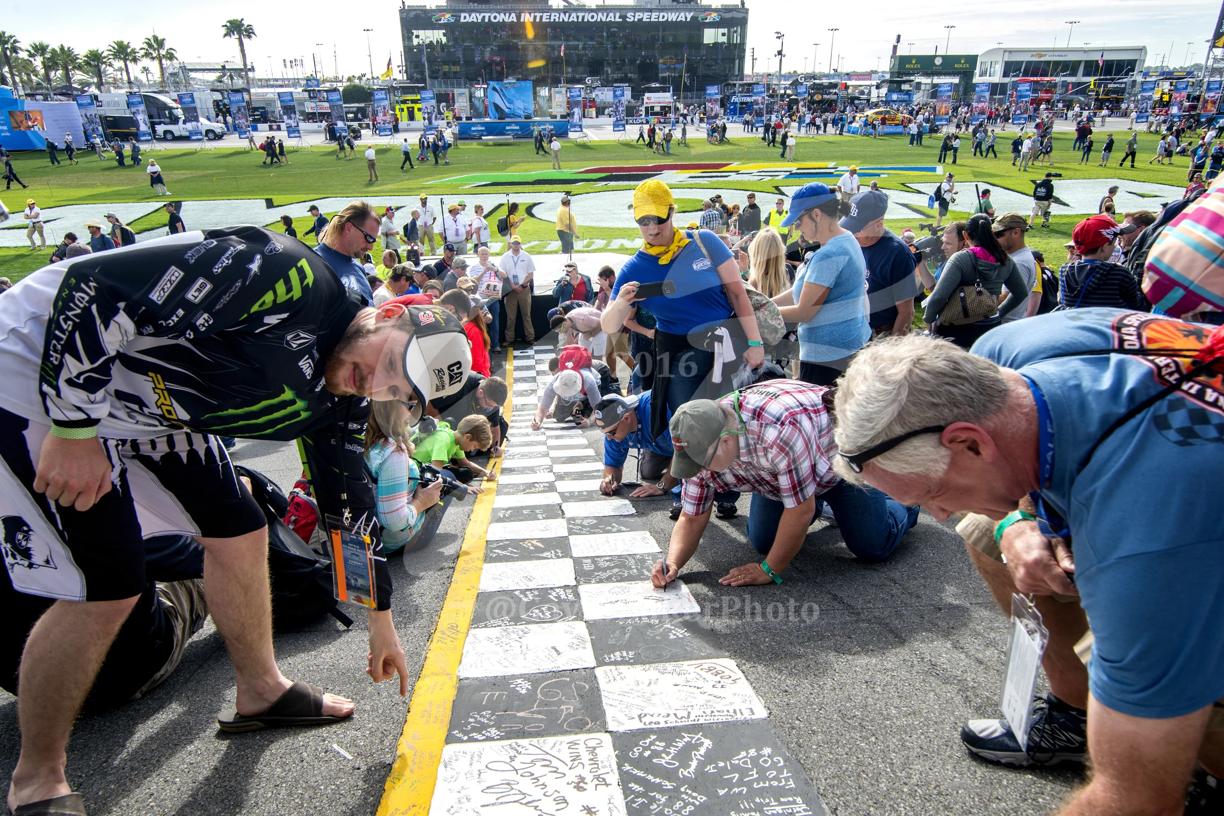 Fans write well wishes, happy birthdays, and cheers for their favorite drivers on the checkered finish line.