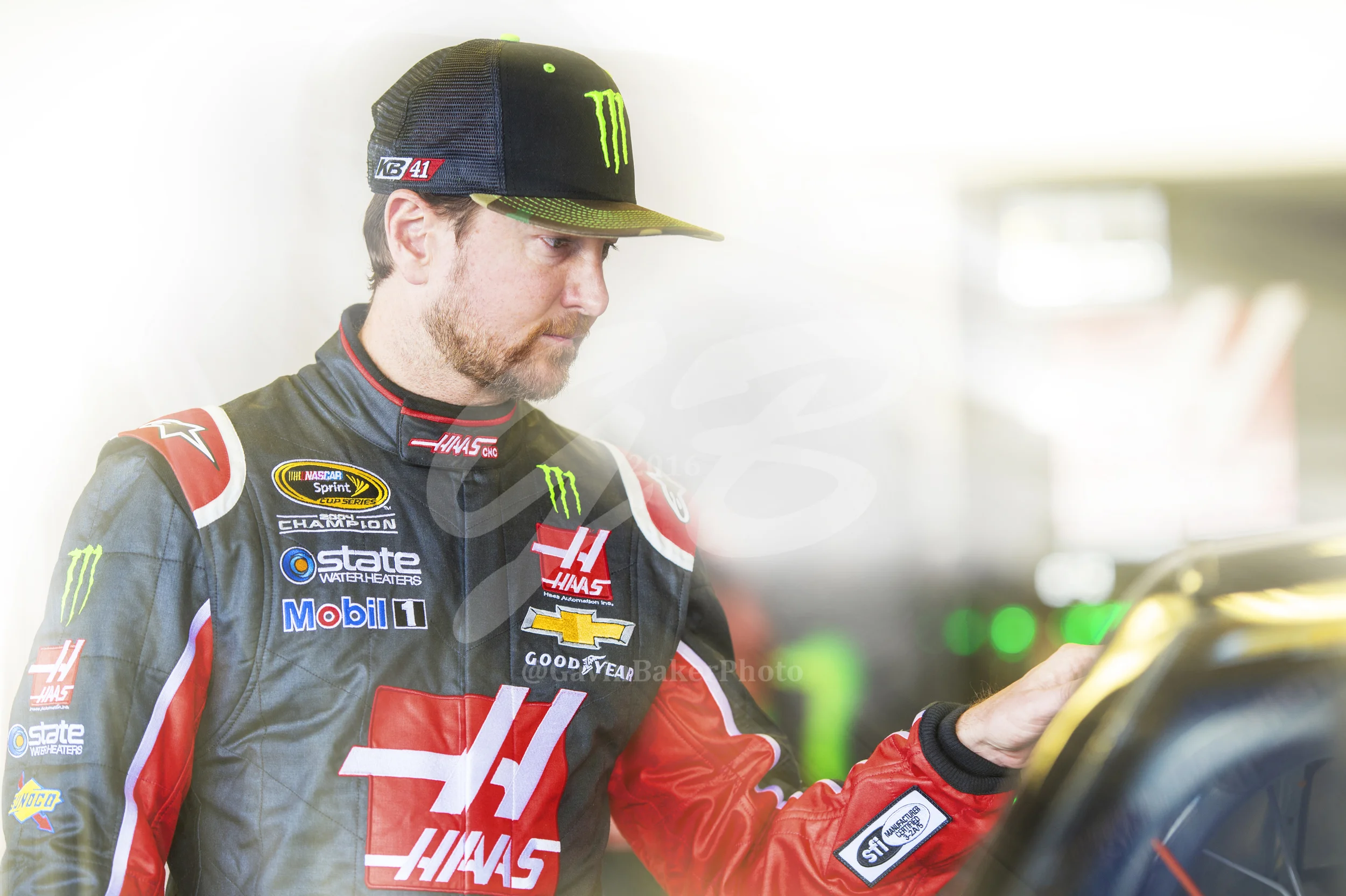 Kurt Busch gently places his hand on the Monster Energy / Haas Chevy and looks deep into the soul of the fire breathing racecar before he heads out to the track.