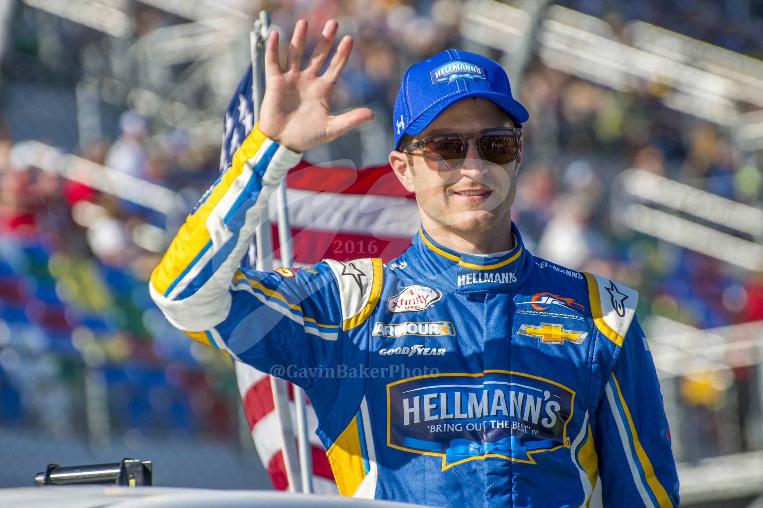 Kasey Kahne, driver of the #5 Hellmann's Chevy, waves to the crowd as he is taken to his racecar for the start of the Daytona 500