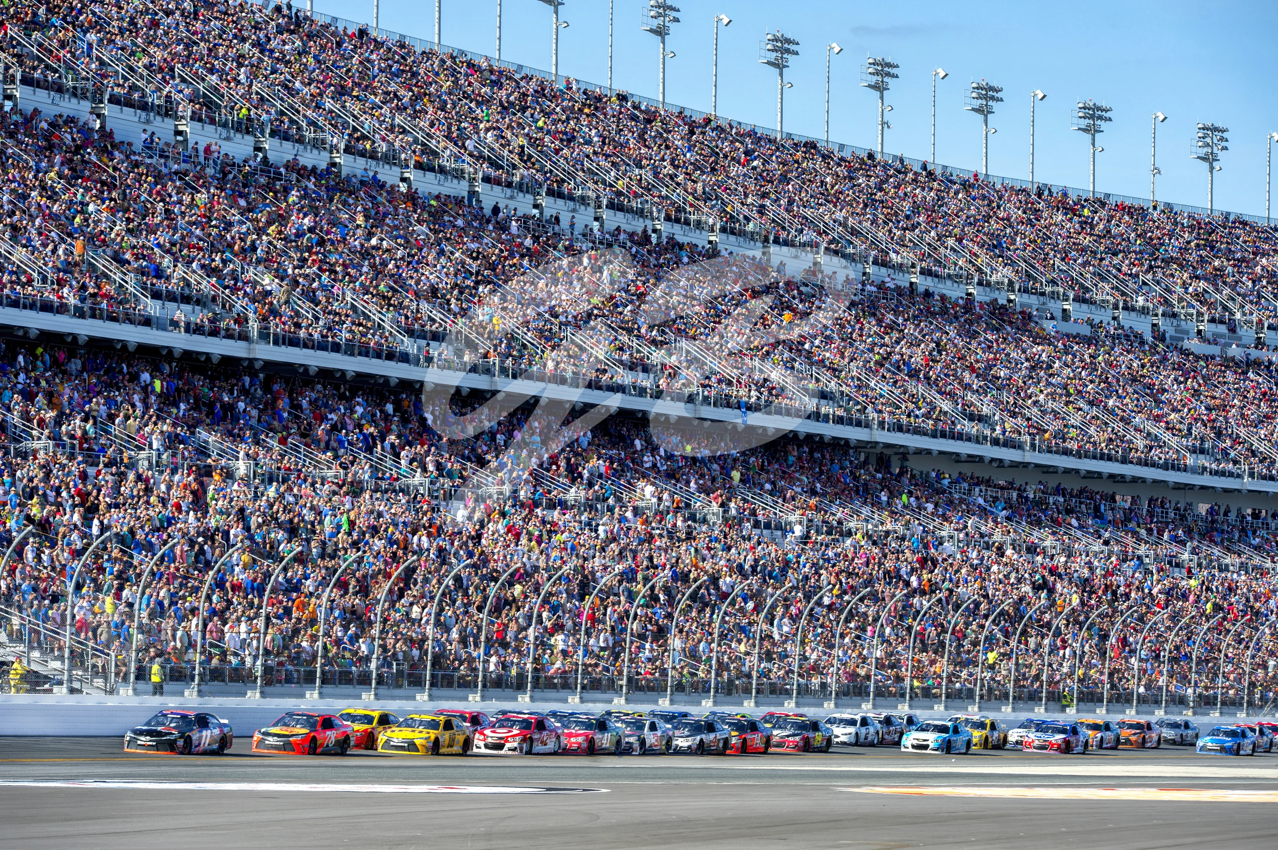 Denny Hamlin leads the field in the #11 FedEx Express Toyota as he enters turn one during the Daytona 500