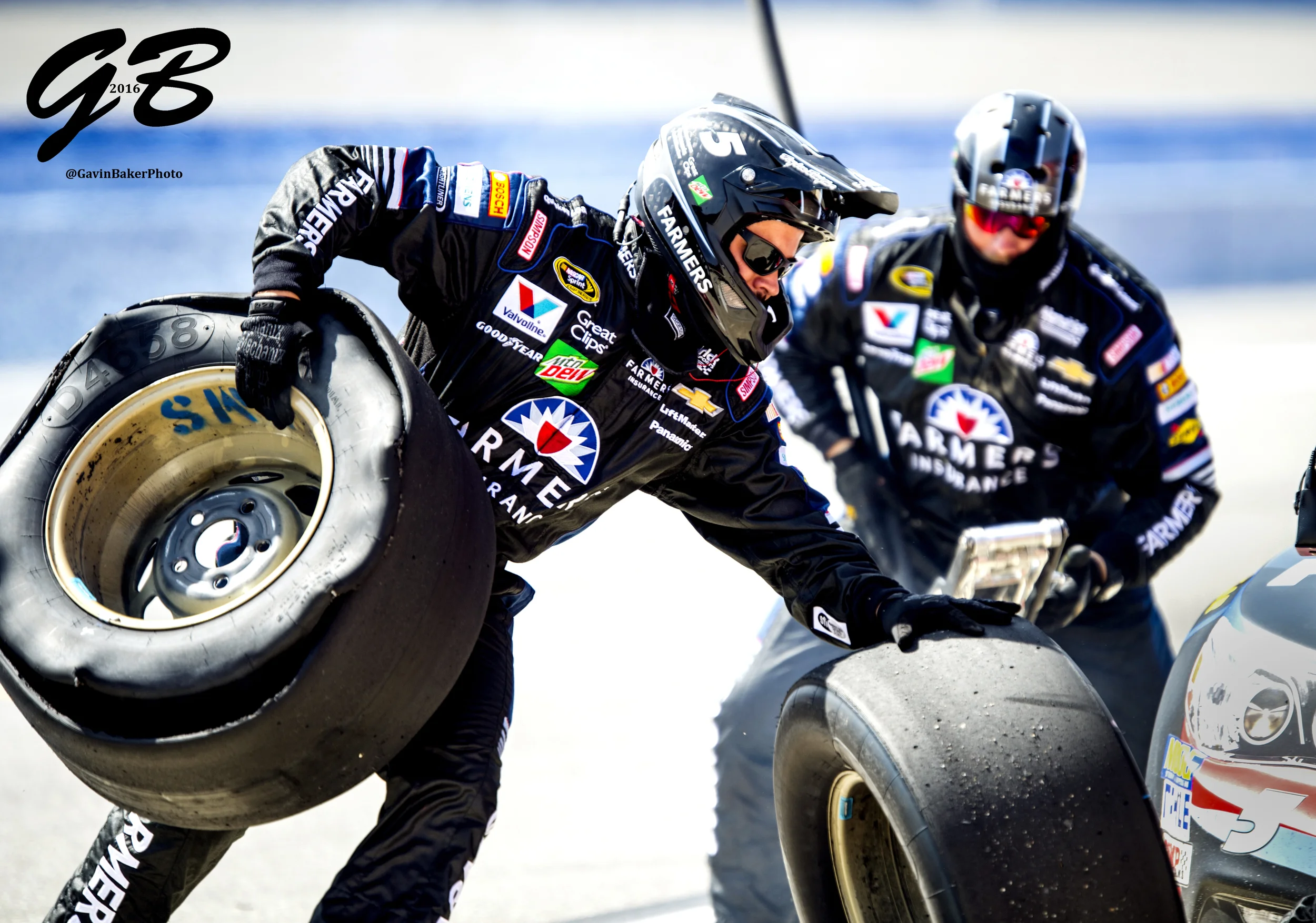 A crew member for #5 Kasey Kahne races back to pit wall with a blown tire during the Auto Club 400 in Fontana Ca.