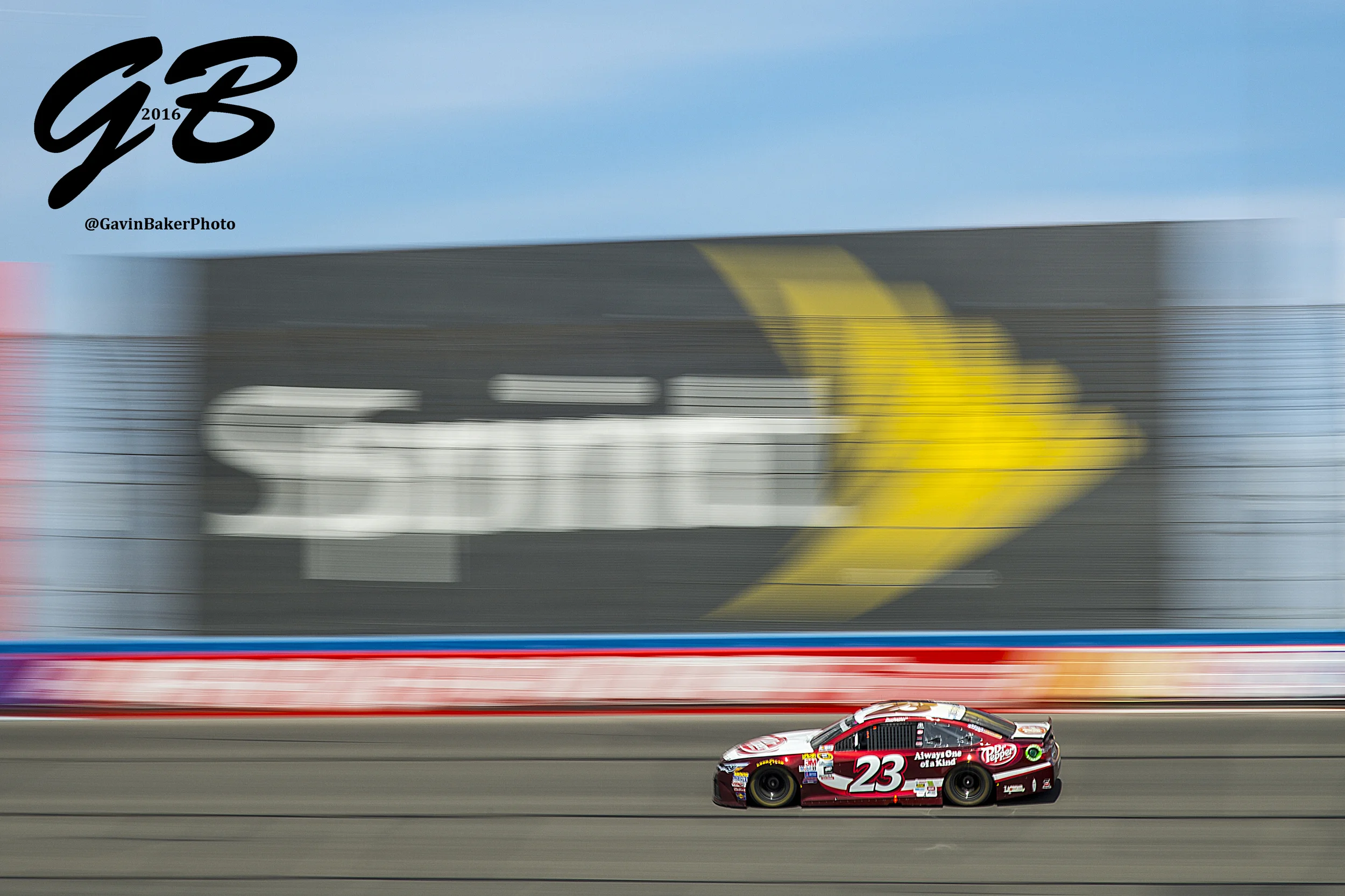 David Ragan races the #23 Dr Pepper Toyota in front on the Sprint billboard during the Auto Club 400 in Fontana Ca.