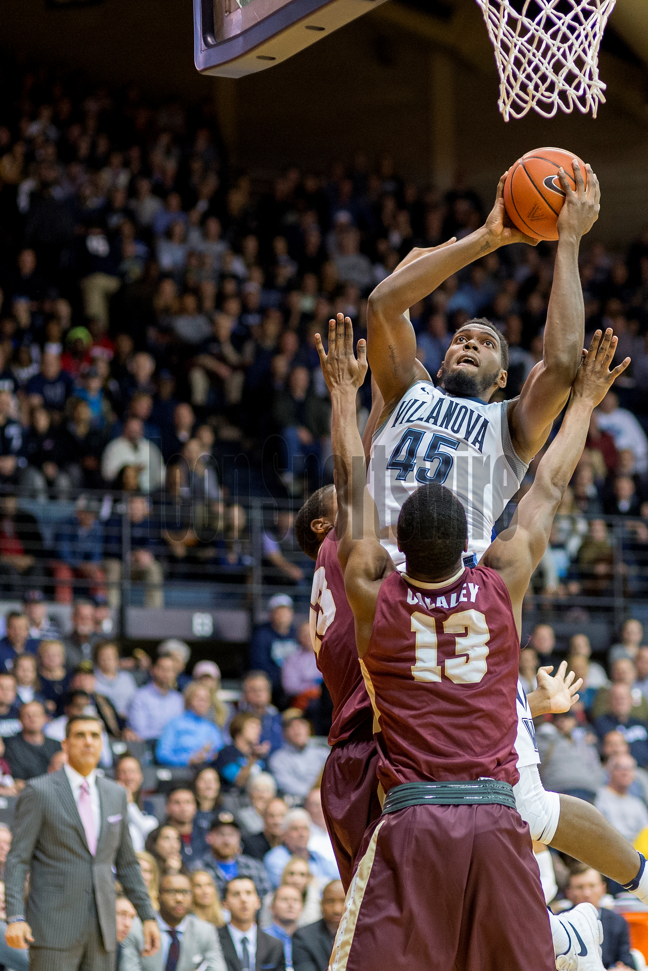  VILLANOVA, PA - NOVEMBER 23: Villanova Wildcats forward Darryl Reynolds (45) leaps over his defenders ready for the basket during the game between the Charleston Cougars and the Villanova Wildcats on November 23, 2016 at the Pavilion in Villanova PA